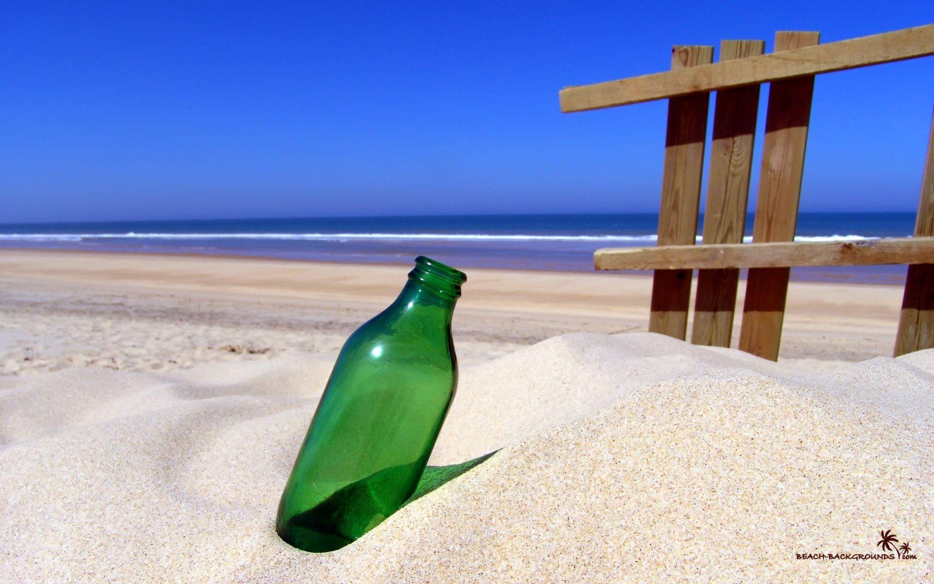 Green Bottle On Sandy Beach Wallpaper 1920x1200