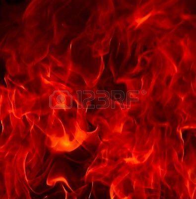 Red Fire Flames Of Hell Against A Black Background. Royalty Free