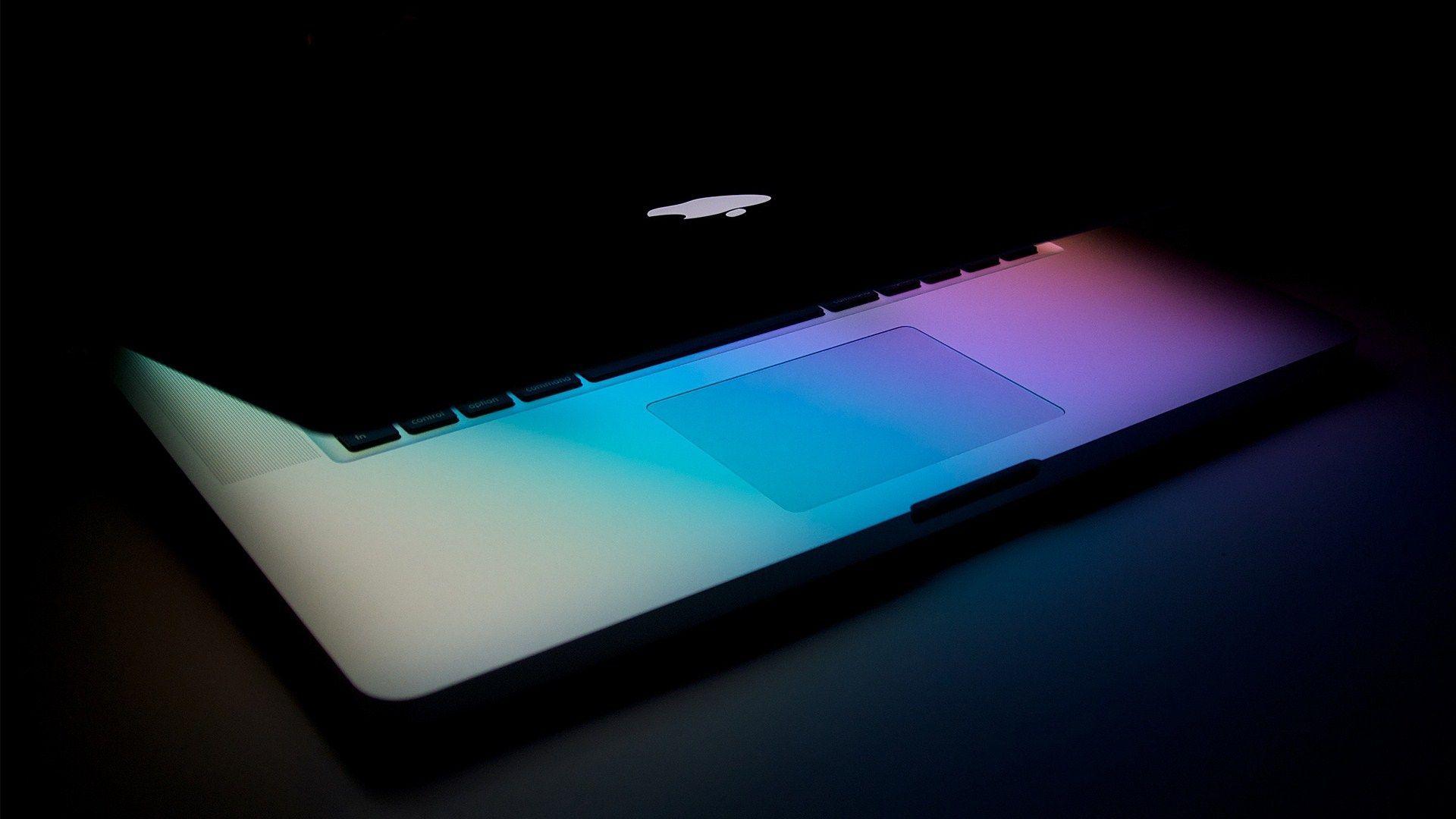 apple laptop screen illuminated halfopen wide HD wallpaper