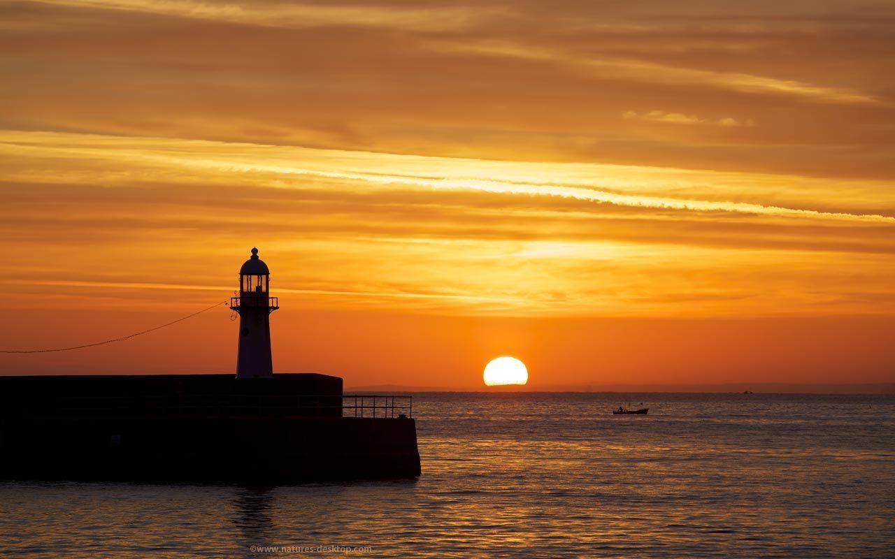 Ocean Sunrise and Lighthouse Background 1280x800 pixels