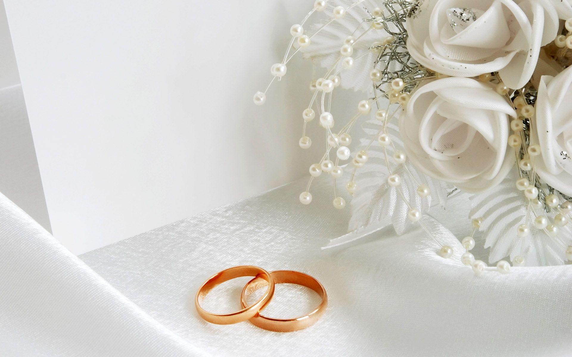 Glamorous Wedding Luxury Gold Rings On The White Invitation