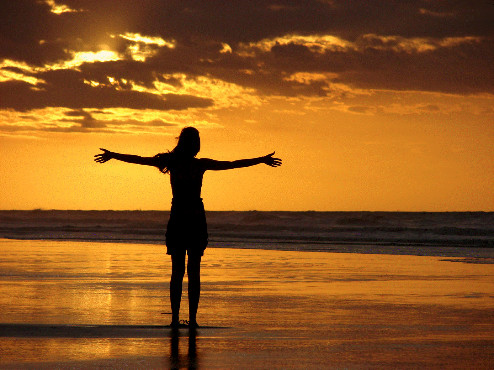 Girl Standing at Beach Sunrise Wallpaper. Beach Wallpaper Background