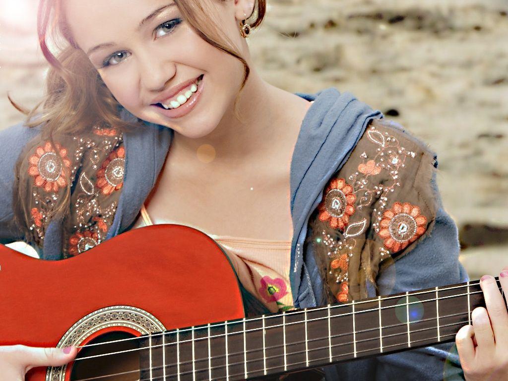 Miley Cyrus Playing Guitar Wallpaper Wallpaper. Wallpaper