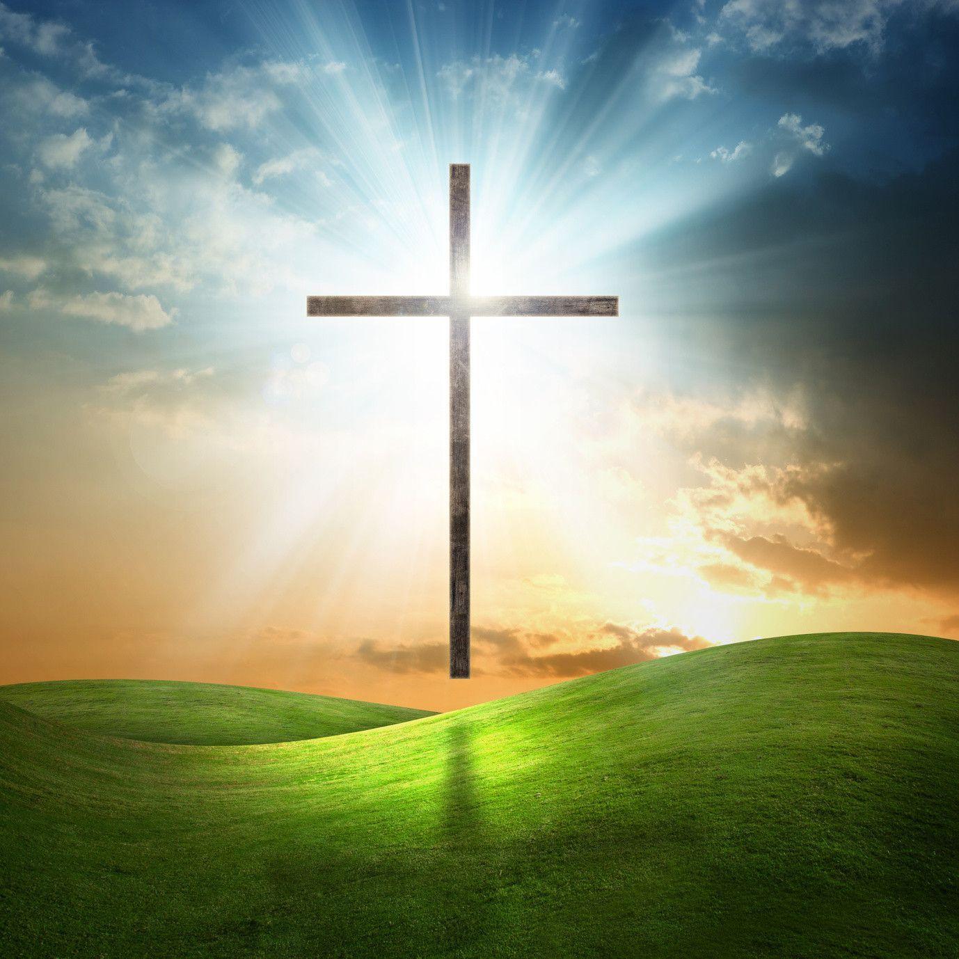 Christian cross on grassy background