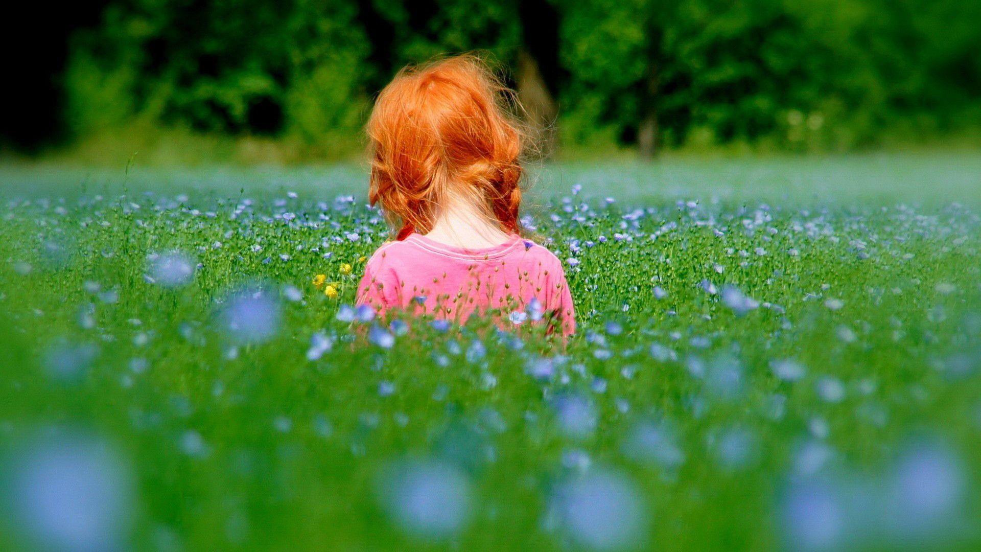 Cute Kid in Garden Wallpaper