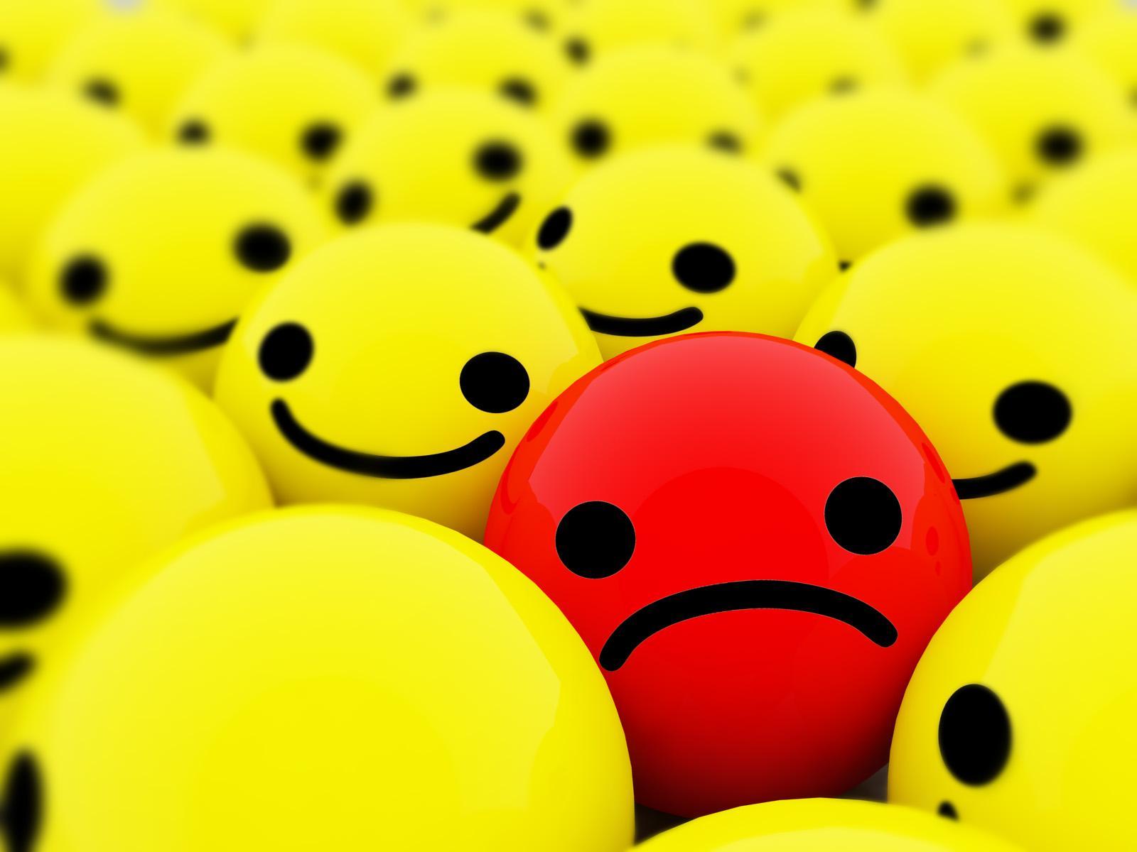 Red smile in yellow smiles free desktop background
