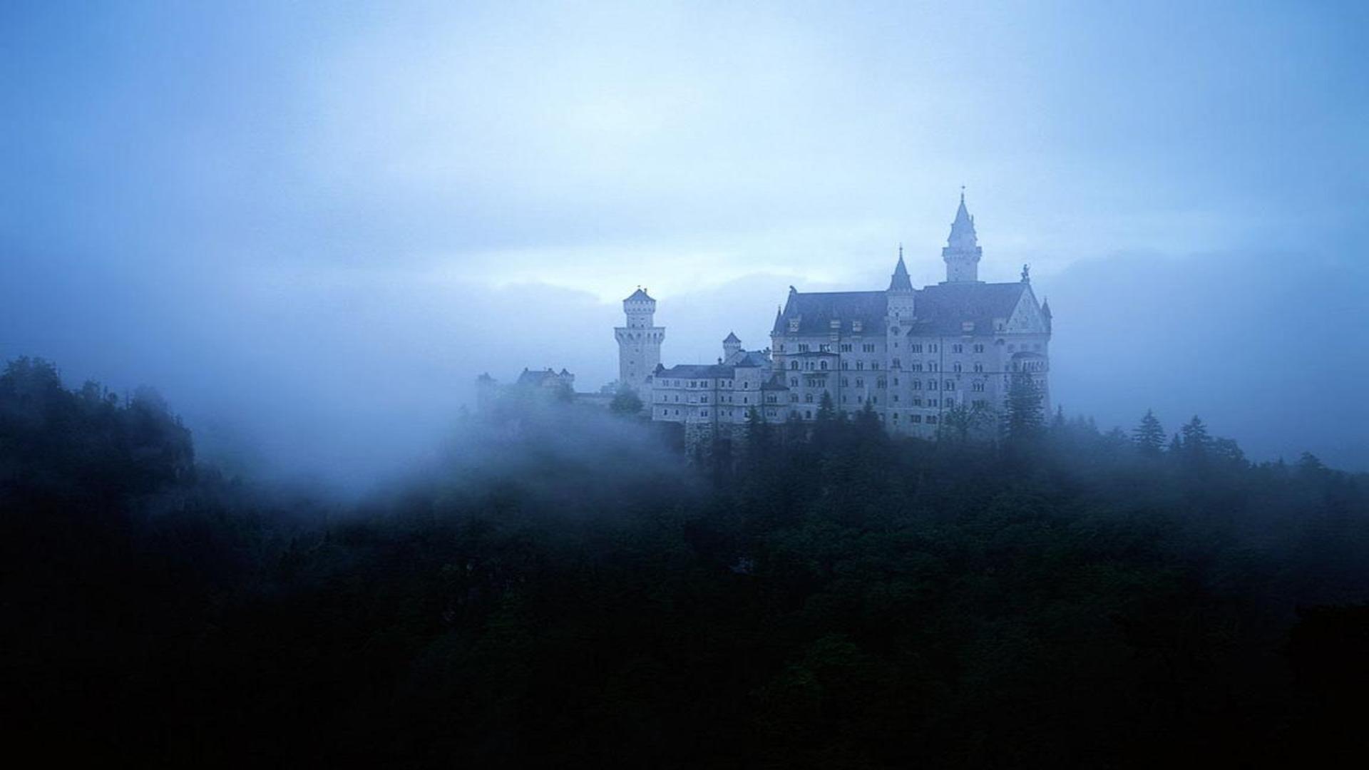 Neuschwanstein castle Bavaria Germany fog misty morning around