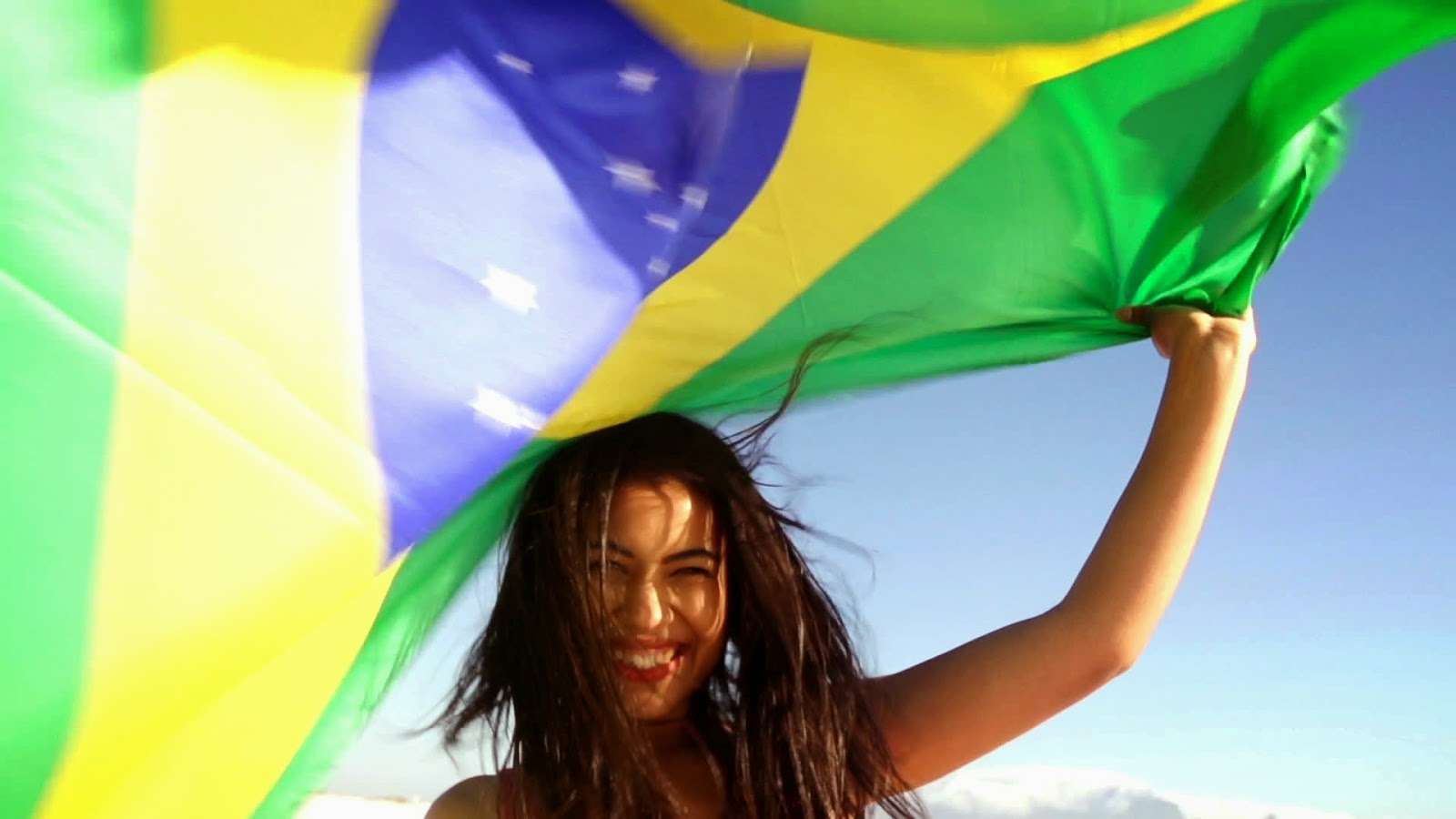 Stock Footage Brazilian Girl With Flag At The Beach In Slow Motion