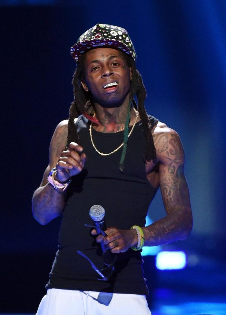 Lil Wayne stable and &;in good spirits&; after health scare