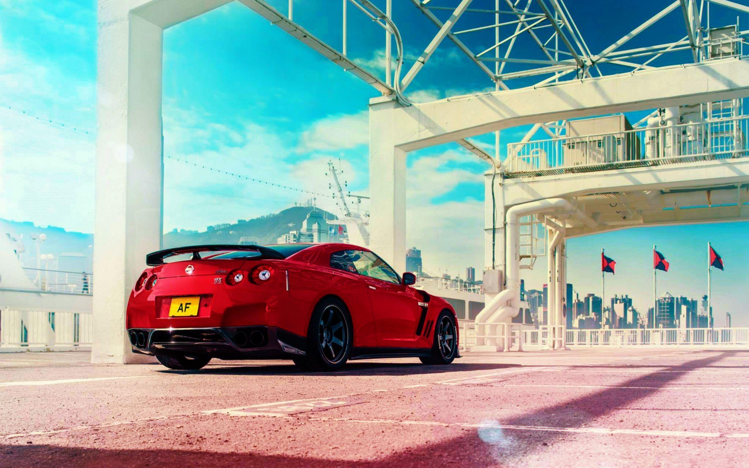 HD Background Nissan GT R Red Color Rear View Sportscar Wallpaper