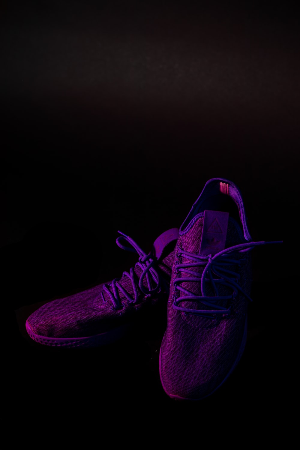 pair of purple mesh running shoes photo