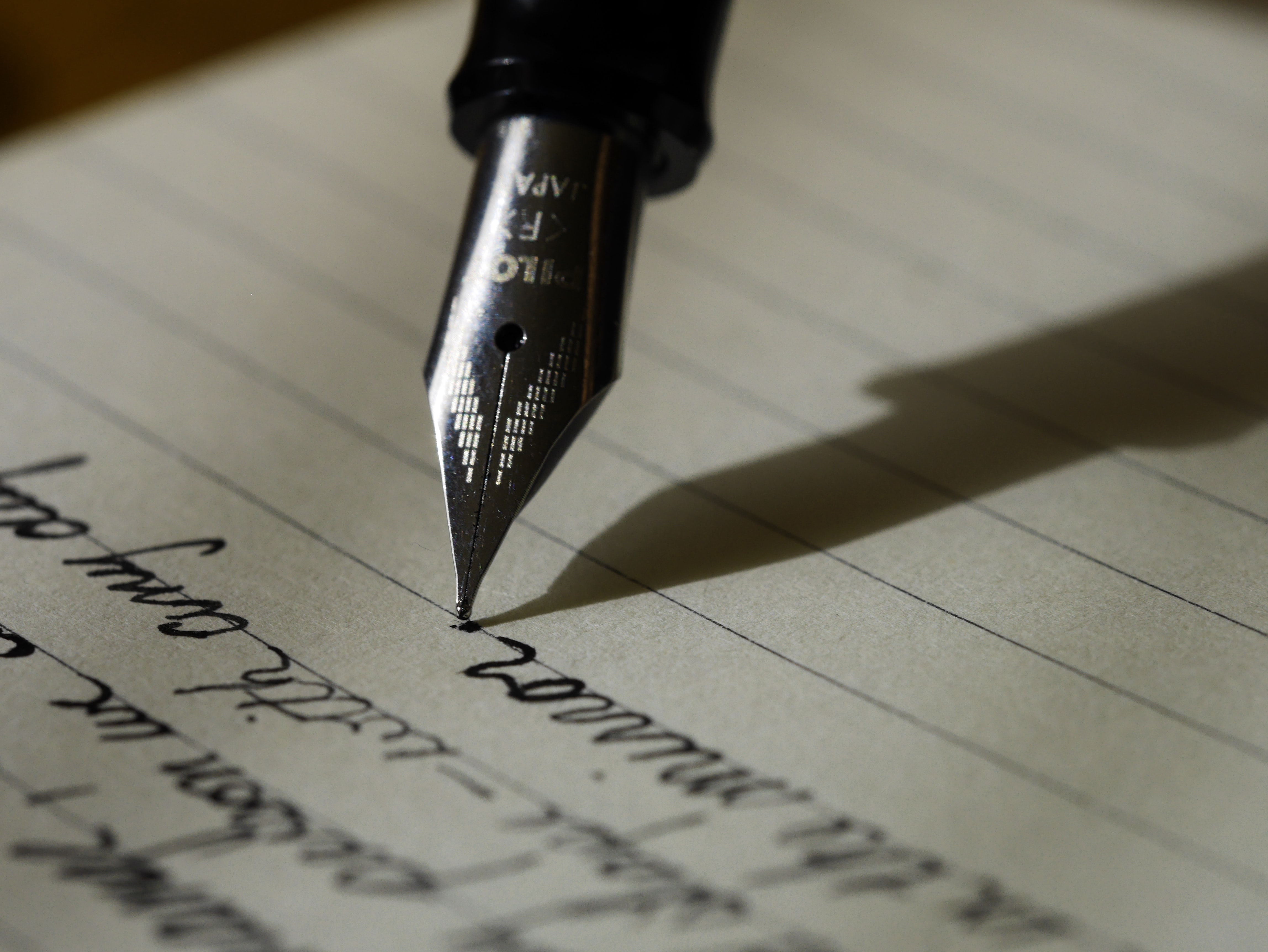 Fountain Pen On Black Lined Paper Writing On Page HD Wallpaper