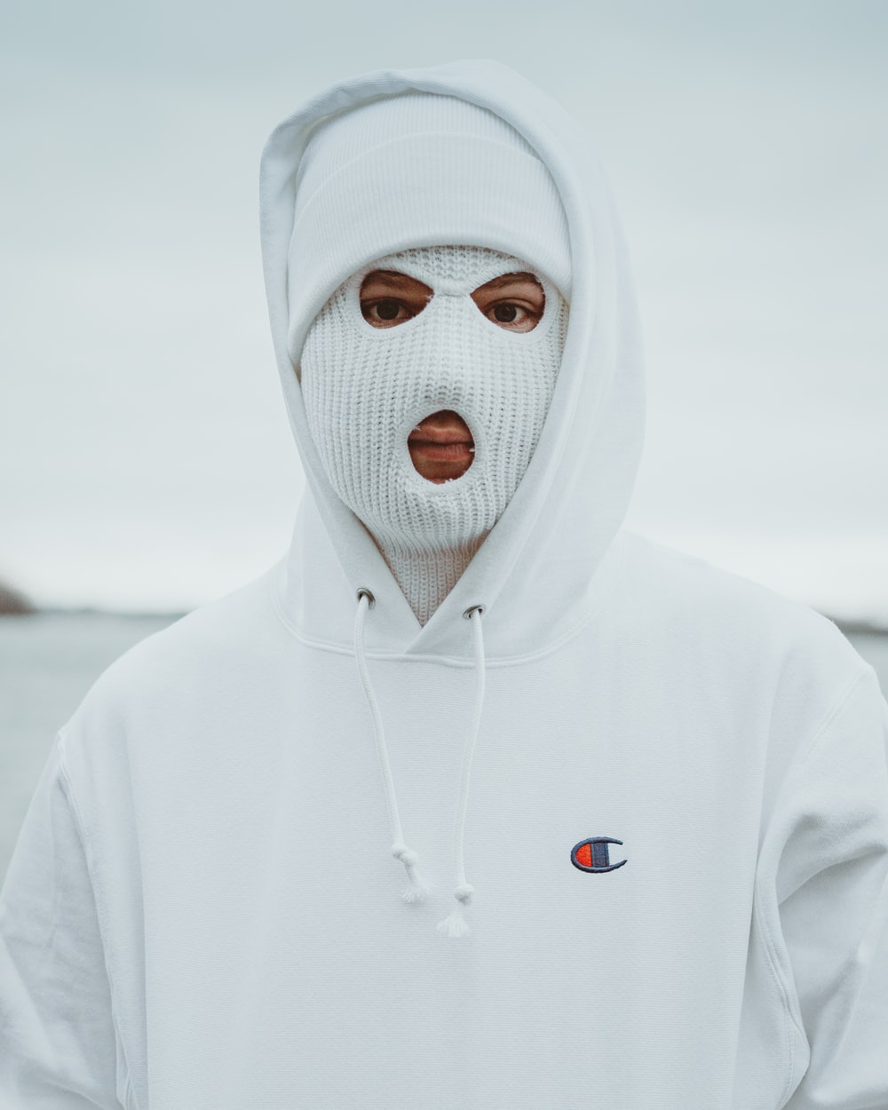 person in white hoodie with white mask photo