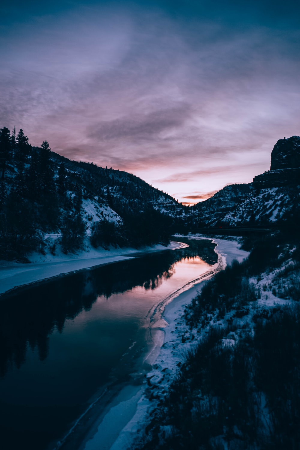 river and mountains during winter photo