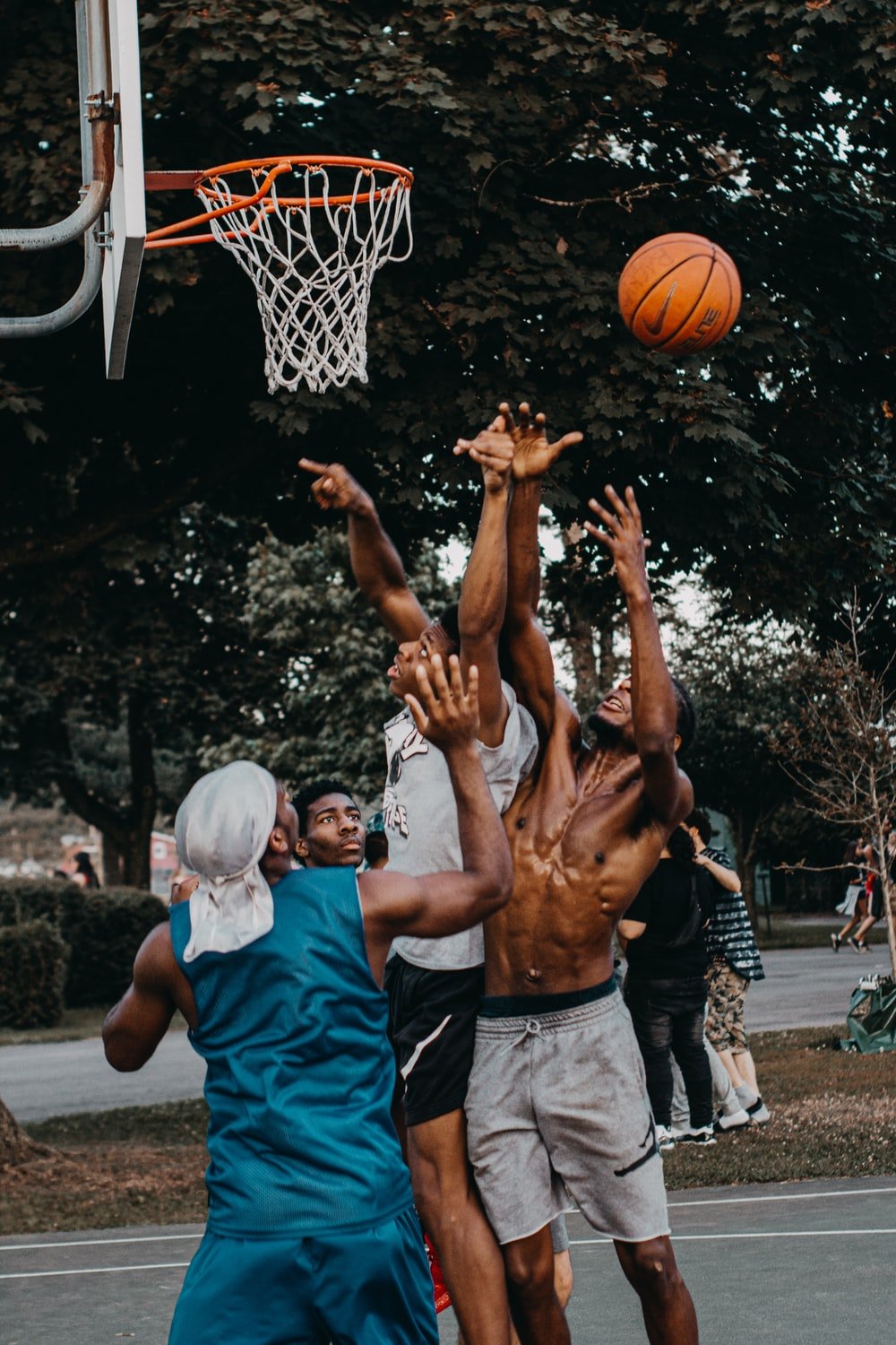 men playing basketball photo