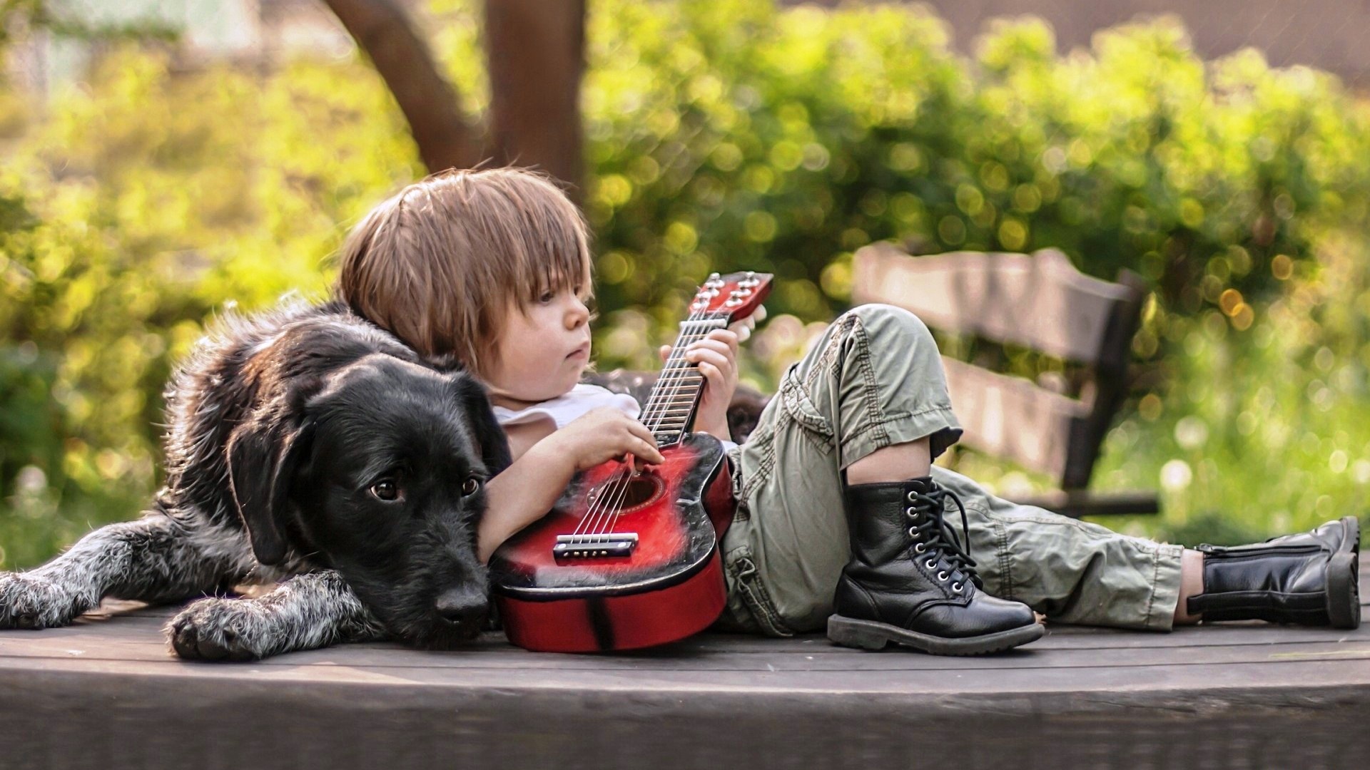 Cute Boy Playing Guitar With Dog Wallpaper