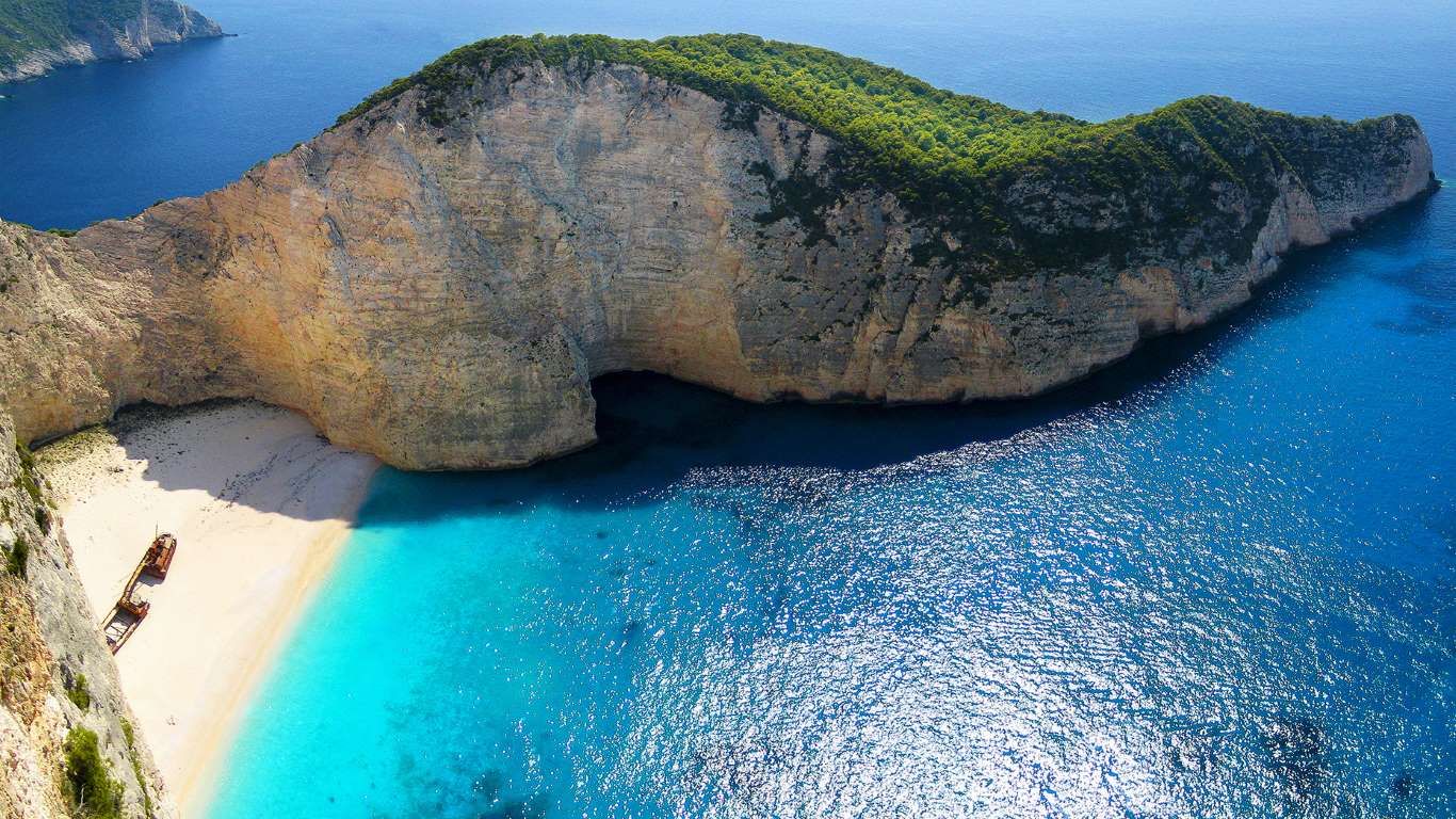 Navagio Beach, Greece Brundle Photography Getty Image. Secluded Beach, Resort Packages, Hotels And Resorts