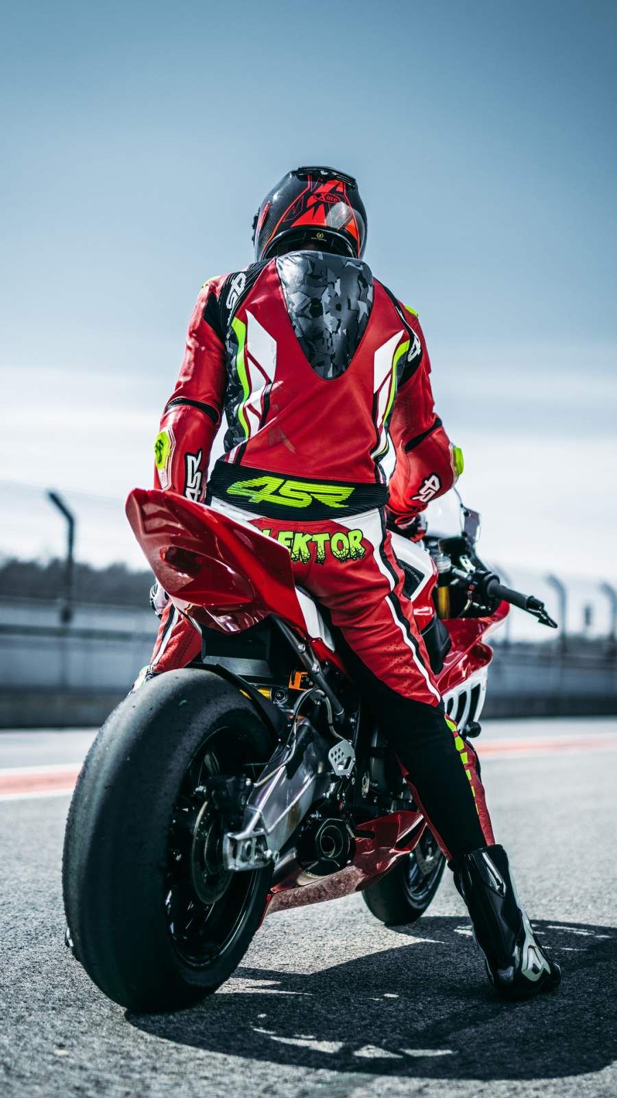 MotoGP Biker iPhone Wallpaper. Motogp, Motorcycle suit, iPhone wallpaper