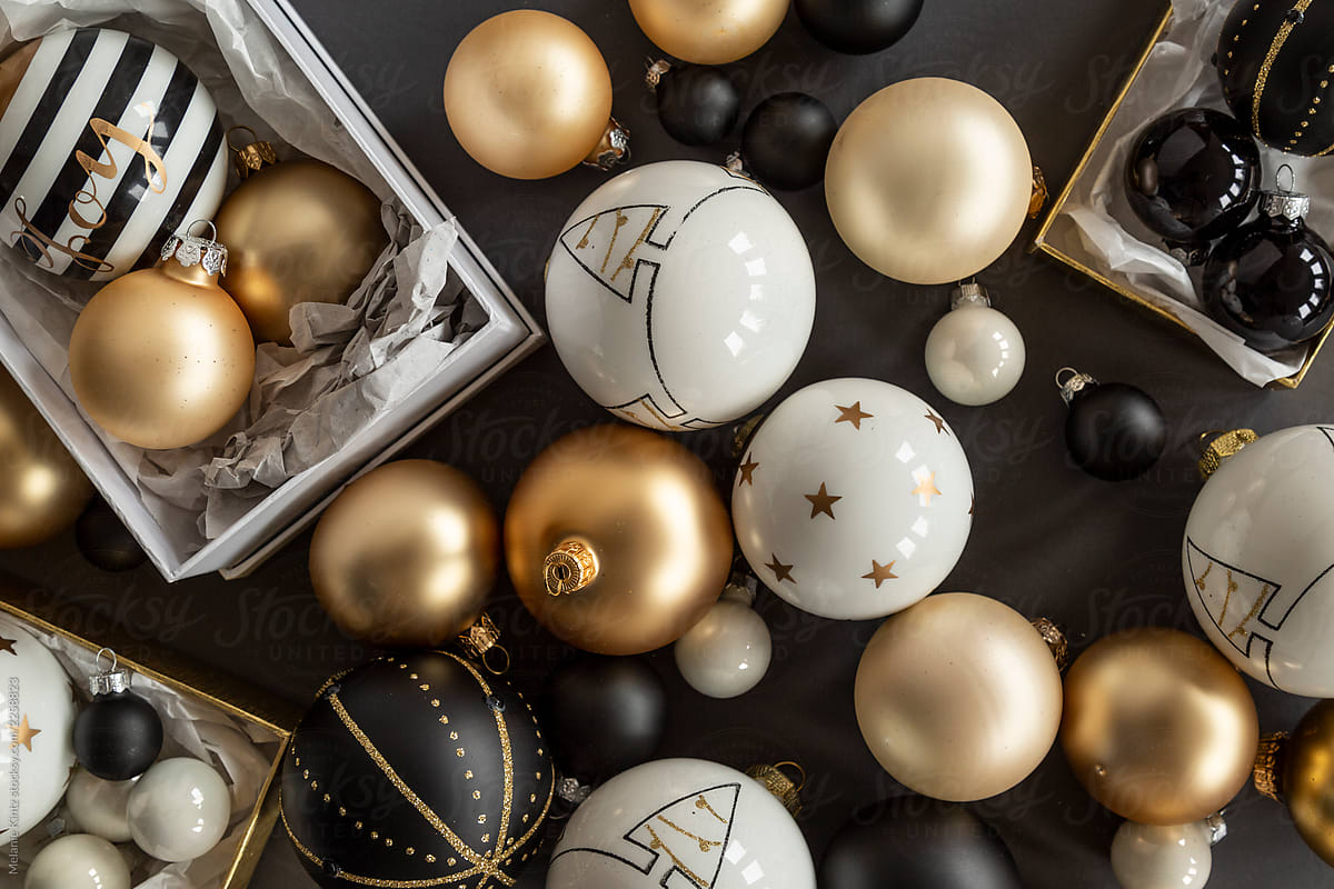 Black, White And Gold Christmas Ornaments On Grey Background by Melanie Kintz, From Above