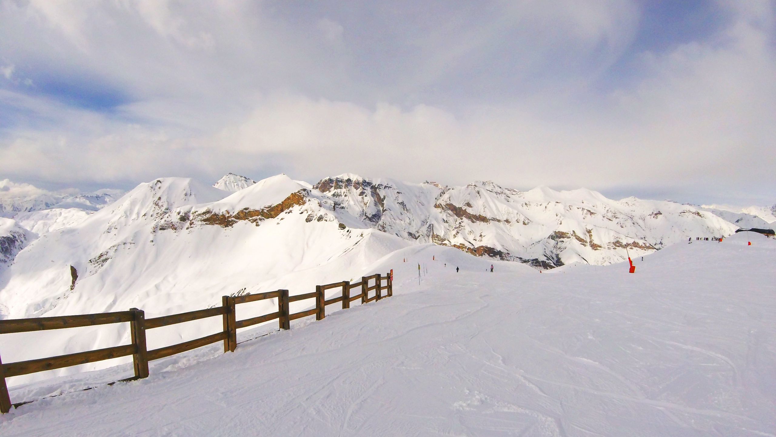 Download wallpaper 2560x1440 snow, mountains, summit, winter widescreen 16:9 HD background