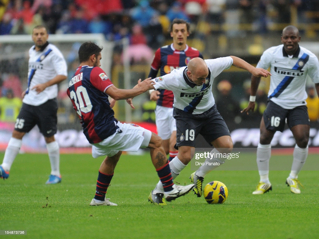 Michele Pazienza of Bologna FC competes with Esteban Cambiasso of FC. News Photo