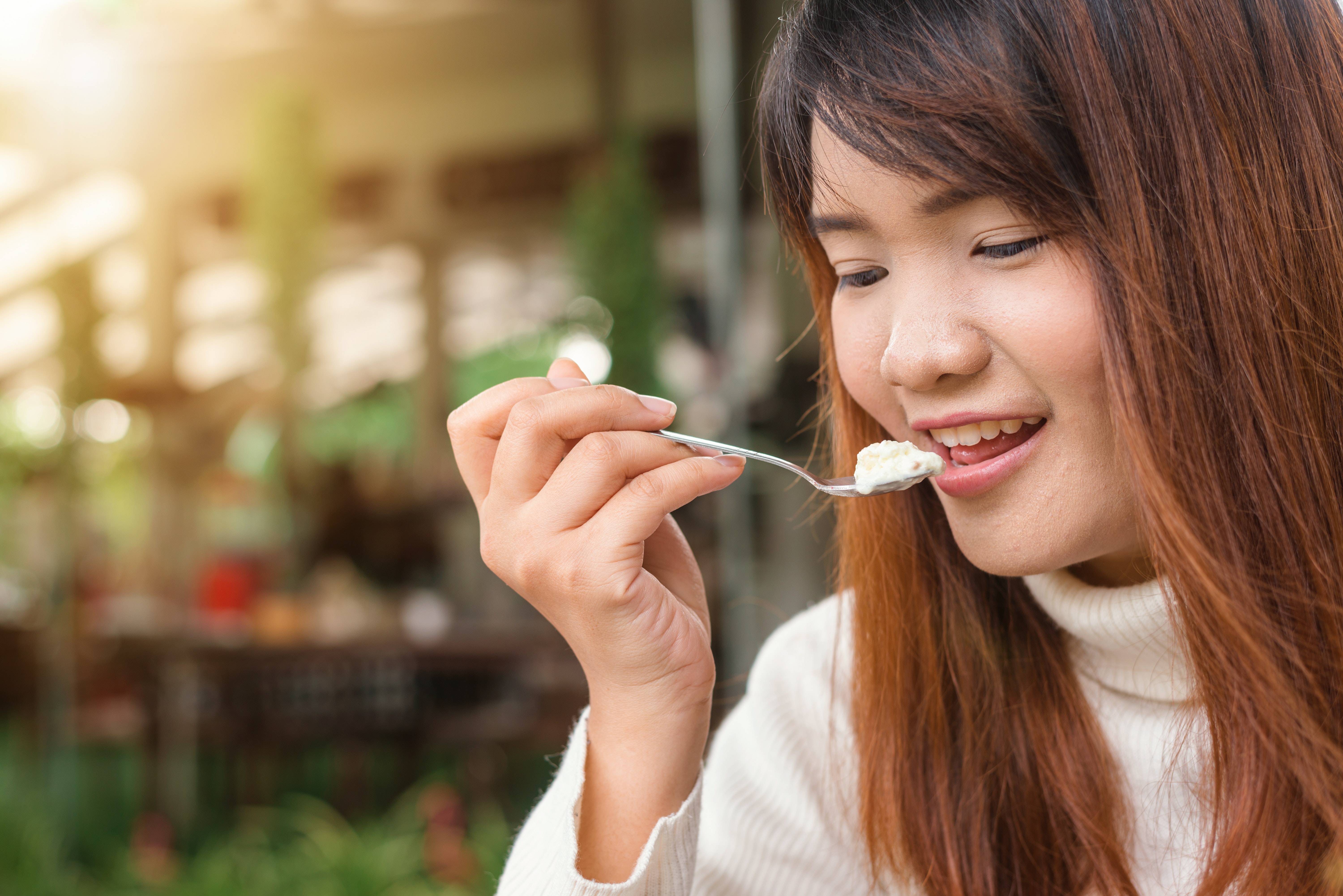 Woman Holding Spoon Trying to Eat White Food · Free