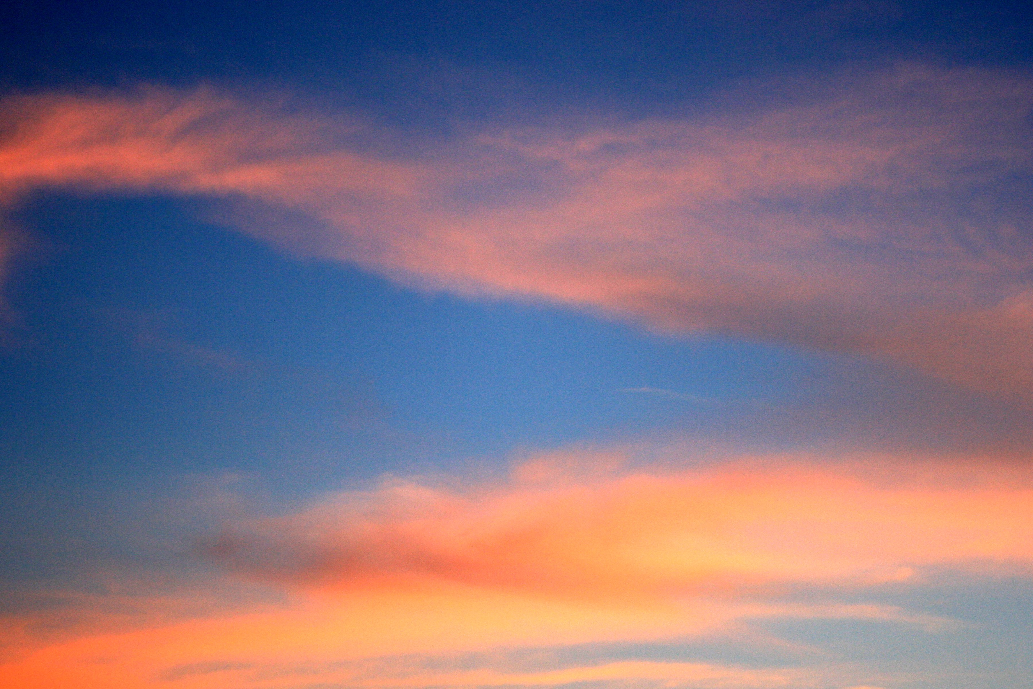 Orange Clouds in Deep Blue Sky Picture. Free Photograph. Photo Public Domain