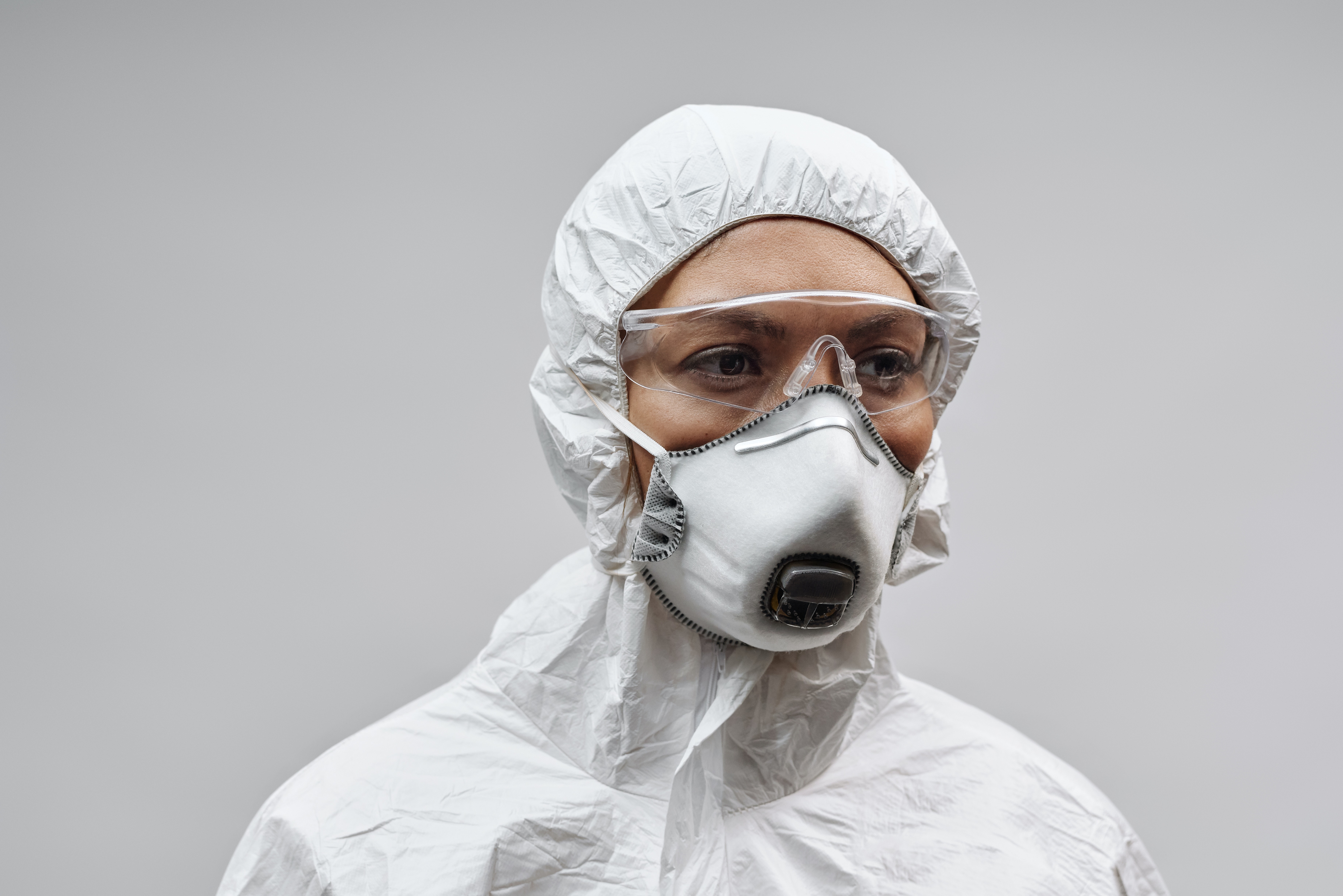 Person Wearing White Face Mask and PPE · Free