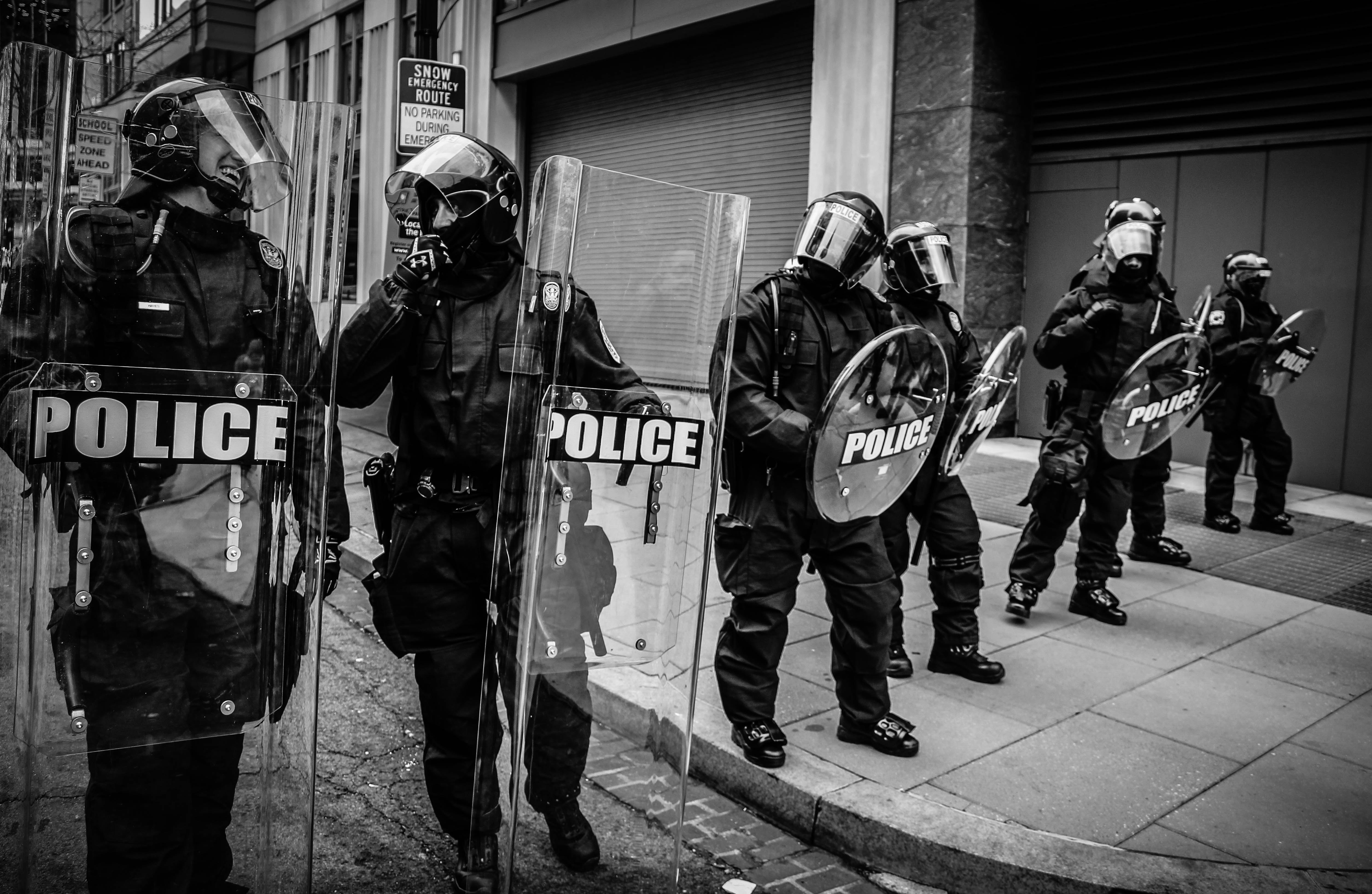 5018x3270 #officers, #group, #law, #manifest, #security system, #pavement, #protestor, #man, #protest, #police, #black and white, #riot gear, #street, #person, #ppe, #riot, #Creative Commons image, #security, #sidewalk, #shield, #uniform