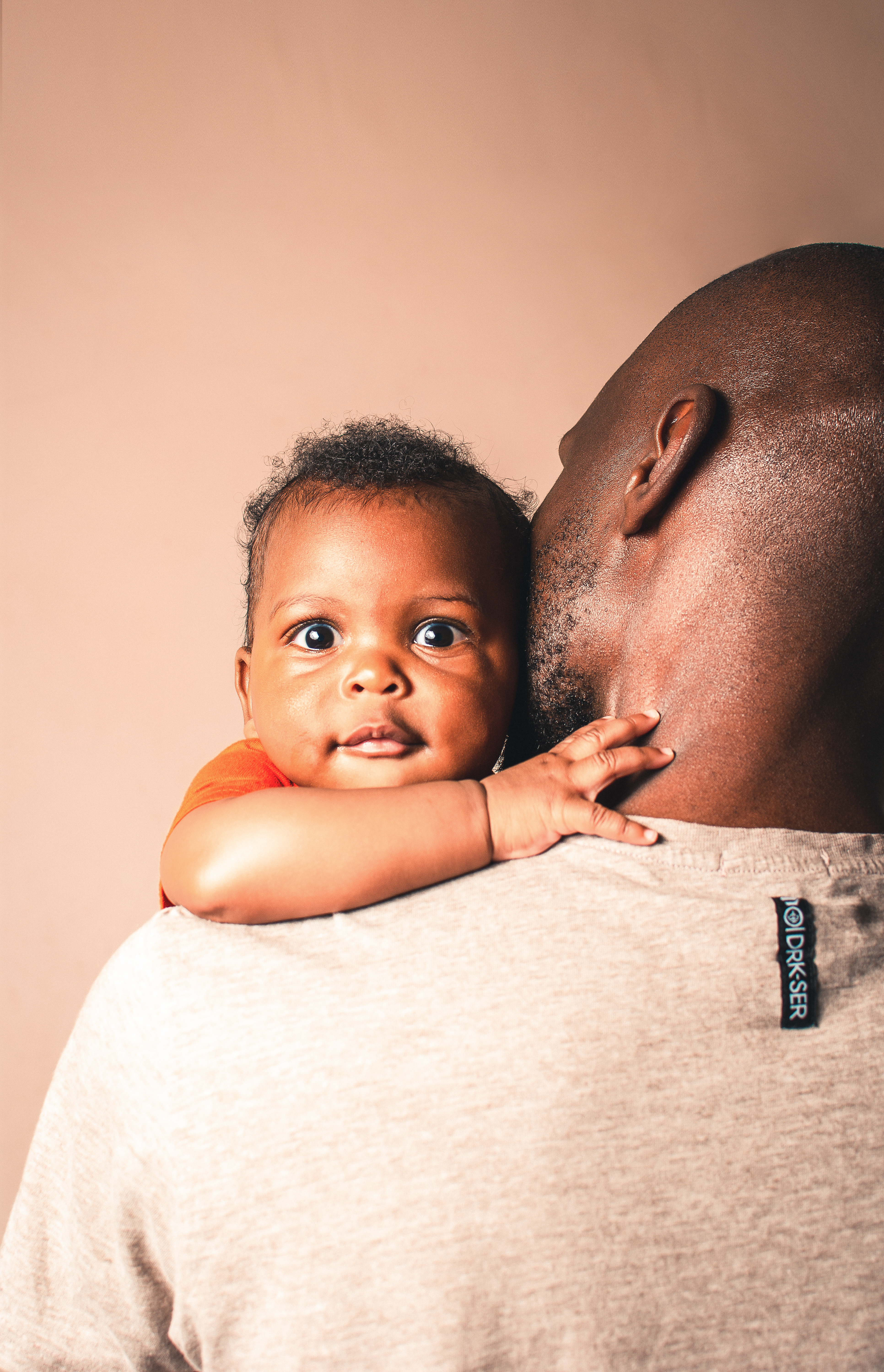Black father hugging cute adorable baby · Free