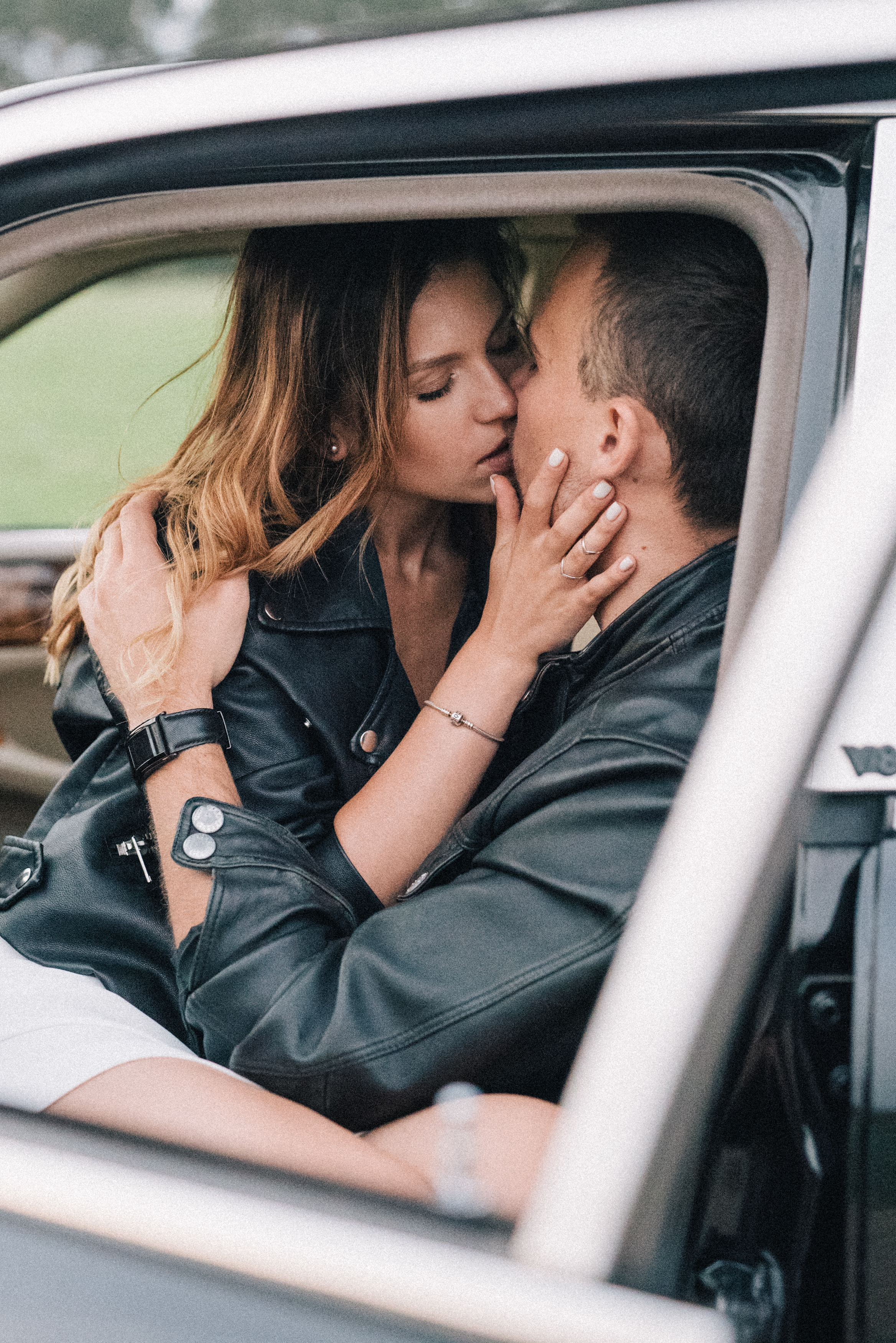 Man and Woman Kissing Inside a Car · Free