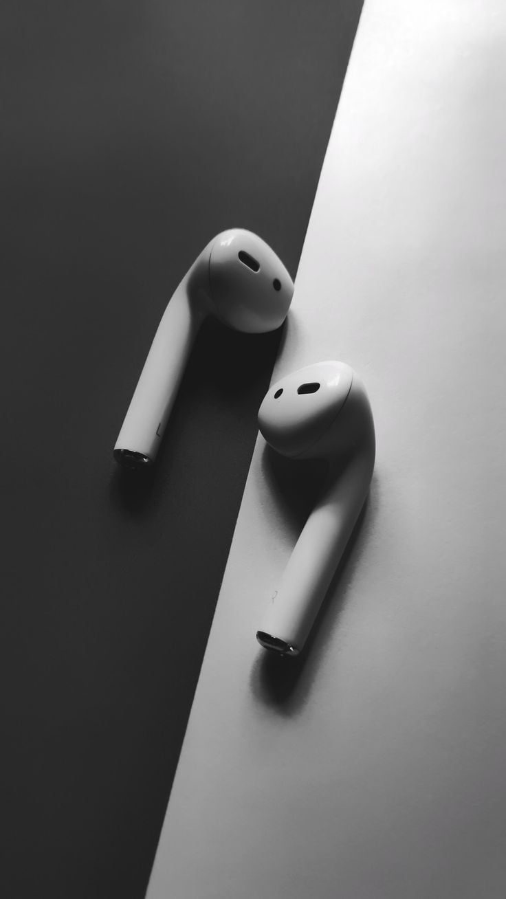 White Apple airpods, headphones Wallpaper in black and white background. Wallpaper. Black and white background, Original iphone wallpaper, Cool wallpaper music