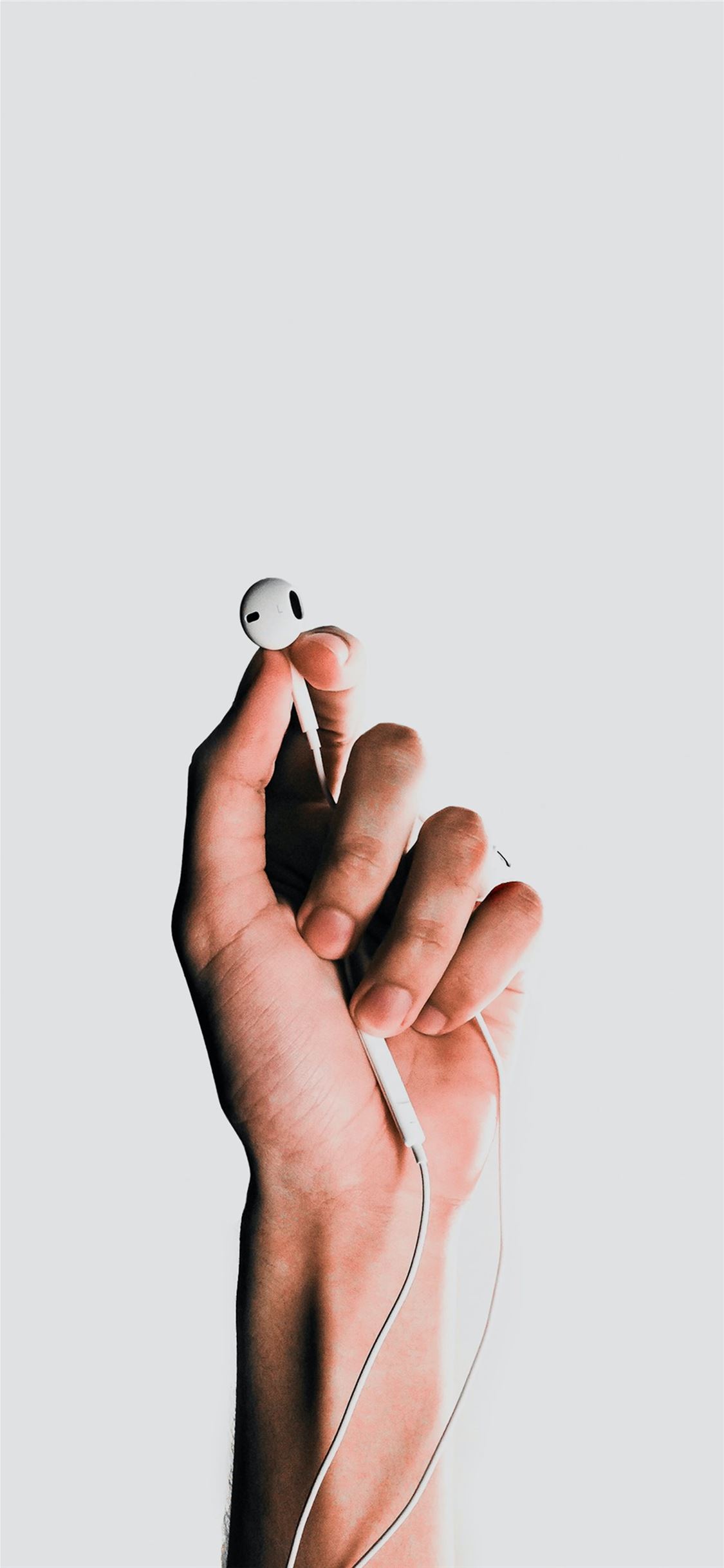 person holding Apple EarPods iPhone 11 Wallpaper Free Download