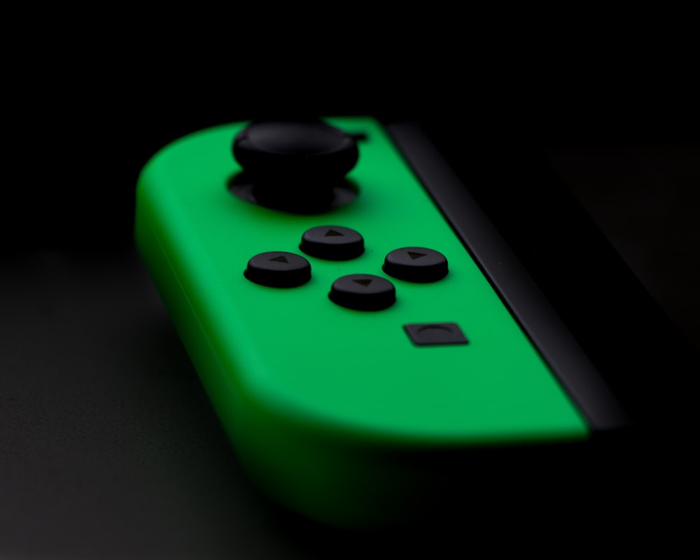 Close Up Photography Of Nintendo Switch Neon Green Controller Photo