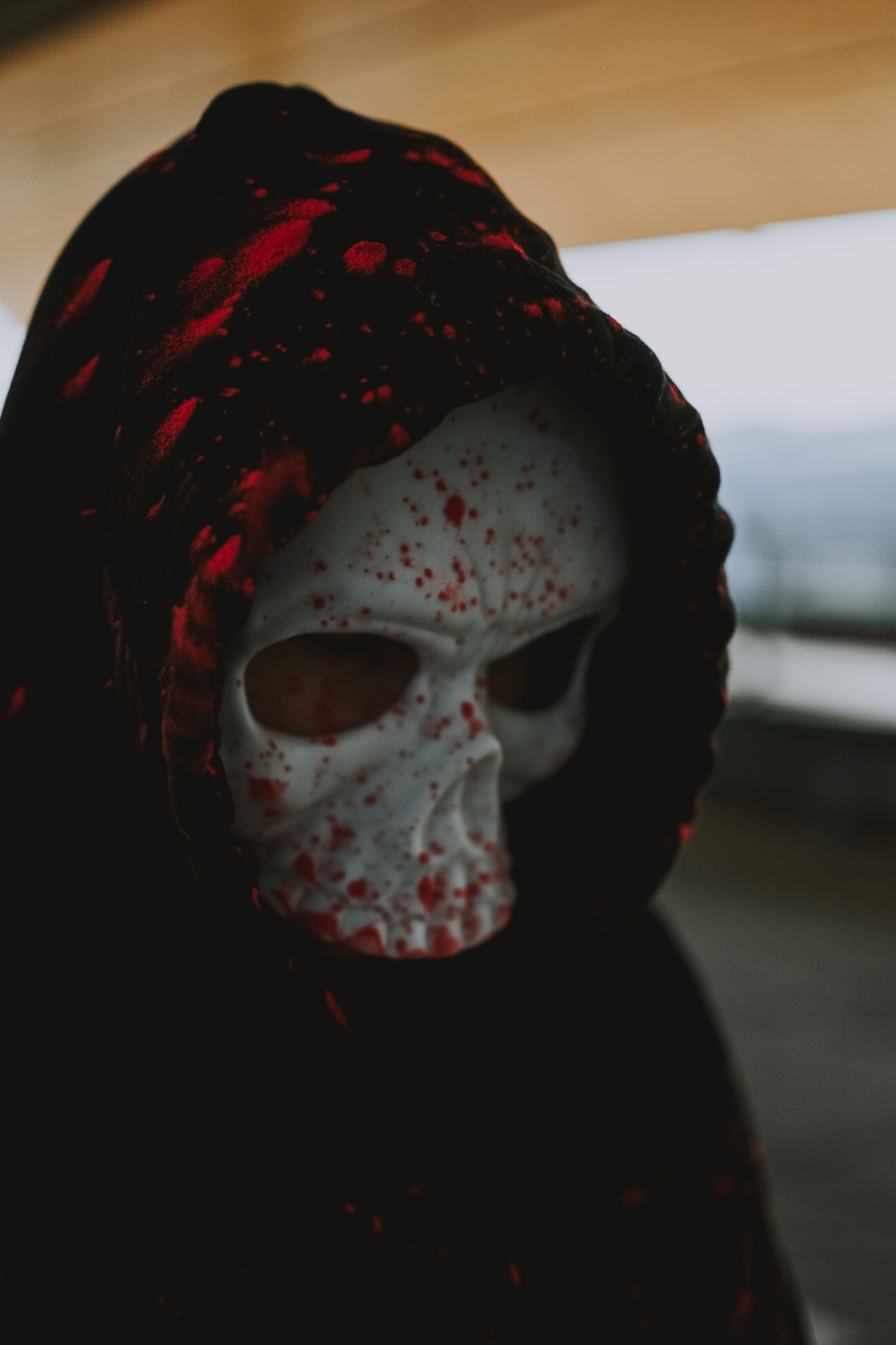 Person wearing scary mask and hood · Free