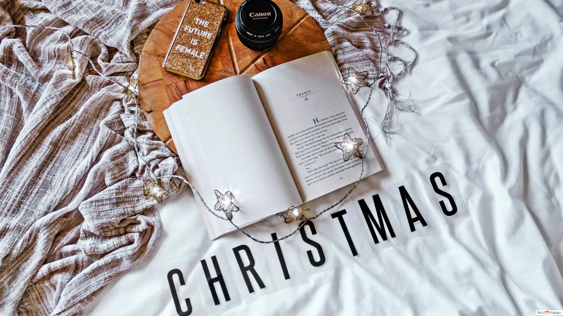Morning Christmas mood with book and star string lights in bed HD wallpaper download