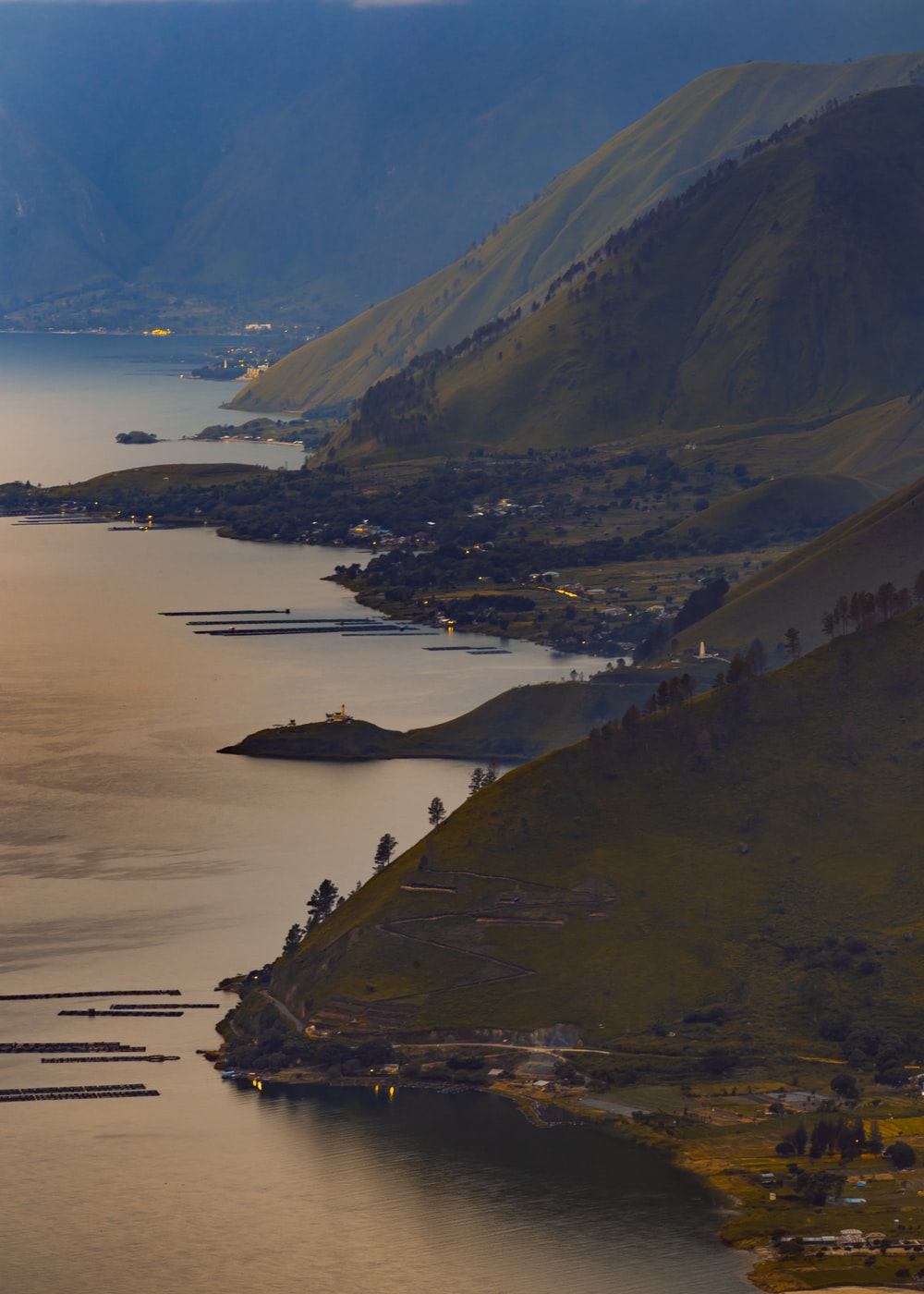 aerial view of mountain near body of water during daytime photo