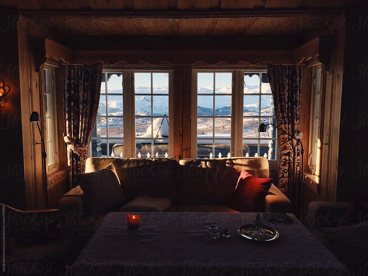 Cozy Cabin Interior In Winter Landscape