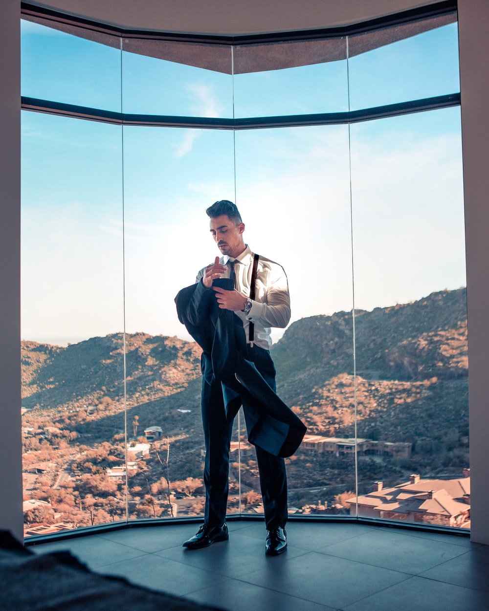 standing man wearing white dress shirt and black dress pants photo