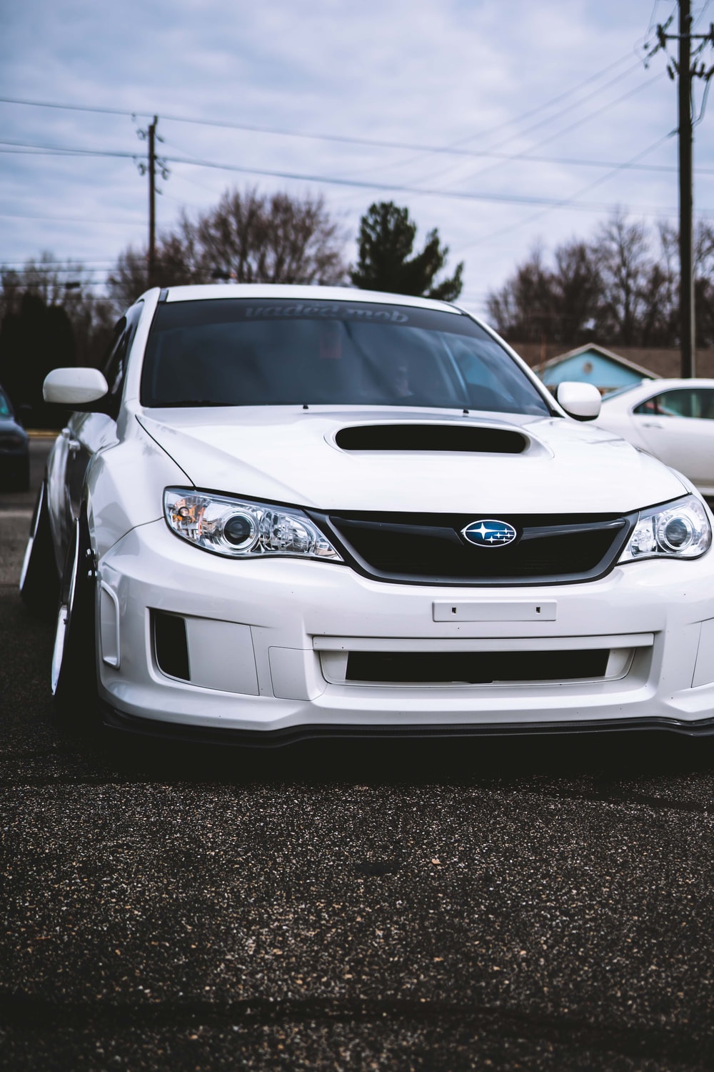 shallow focus photo of white Subaru car photo
