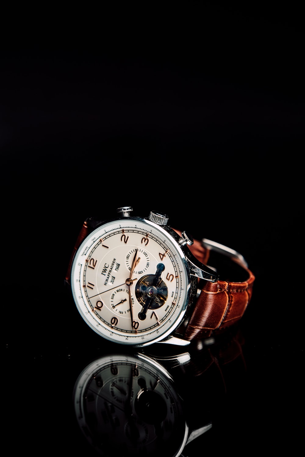 Round Silver Colored Chronograph Watch With Brown Leather Strap Photo
