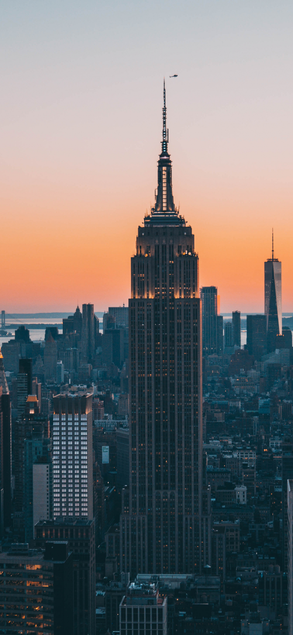Download 1125x2436 wallpaper empire state building, buildings, sunset, new york city, iphone x 1125x2436 HD image, background, 689