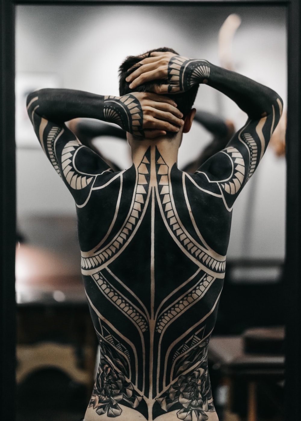 person wearing full body tattoo art photo