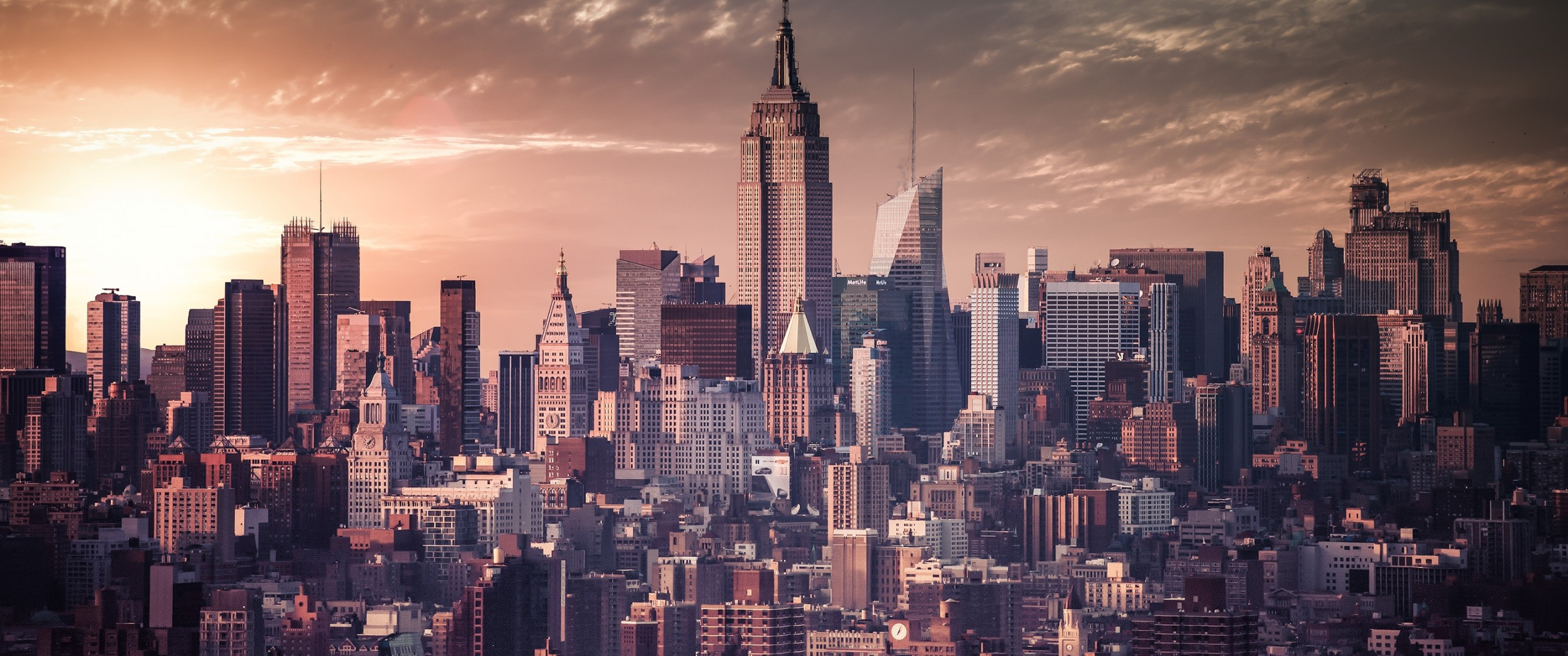 Download 2580x1080 New York, Cityscape, Skyscrapers, Buildings, Sunset, Sky, Clouds Wallpaper