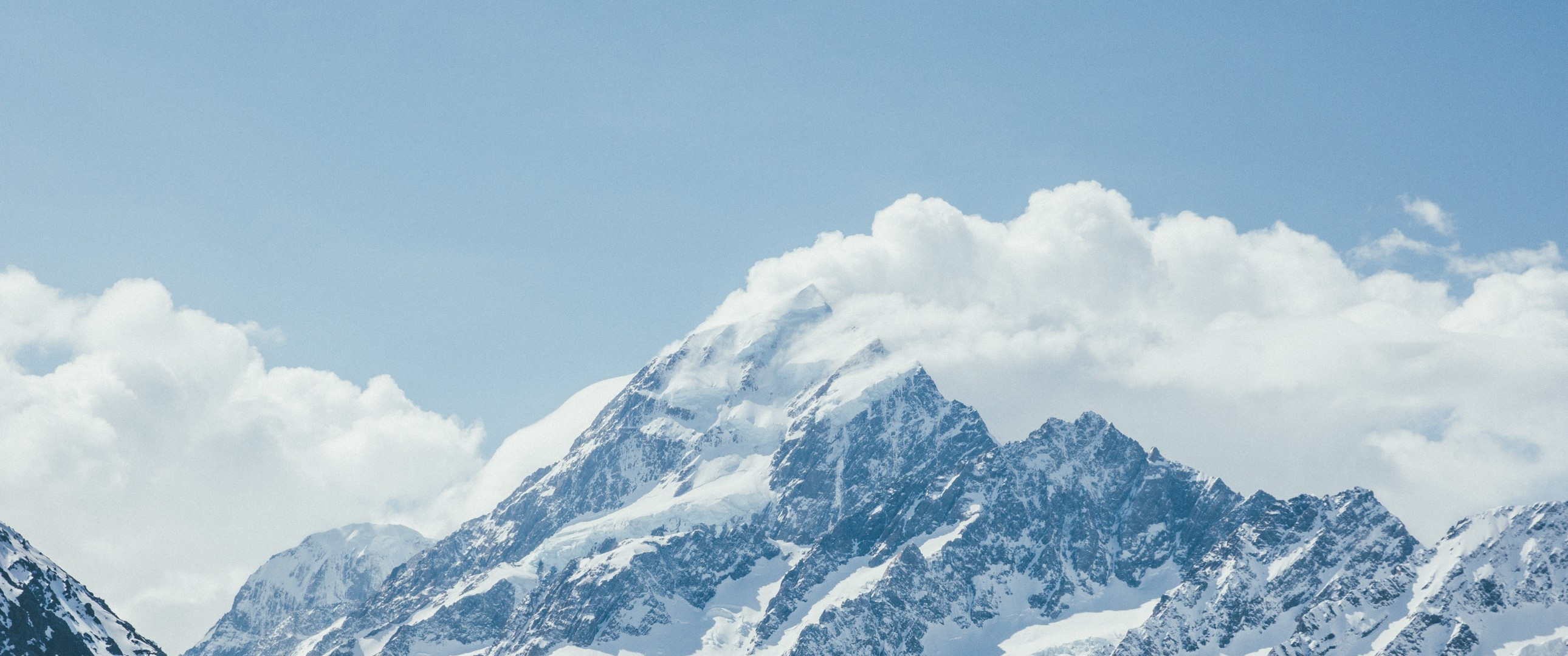 Download 2580x1080 Mountain, Snow, Winter, Clouds Wallpaper