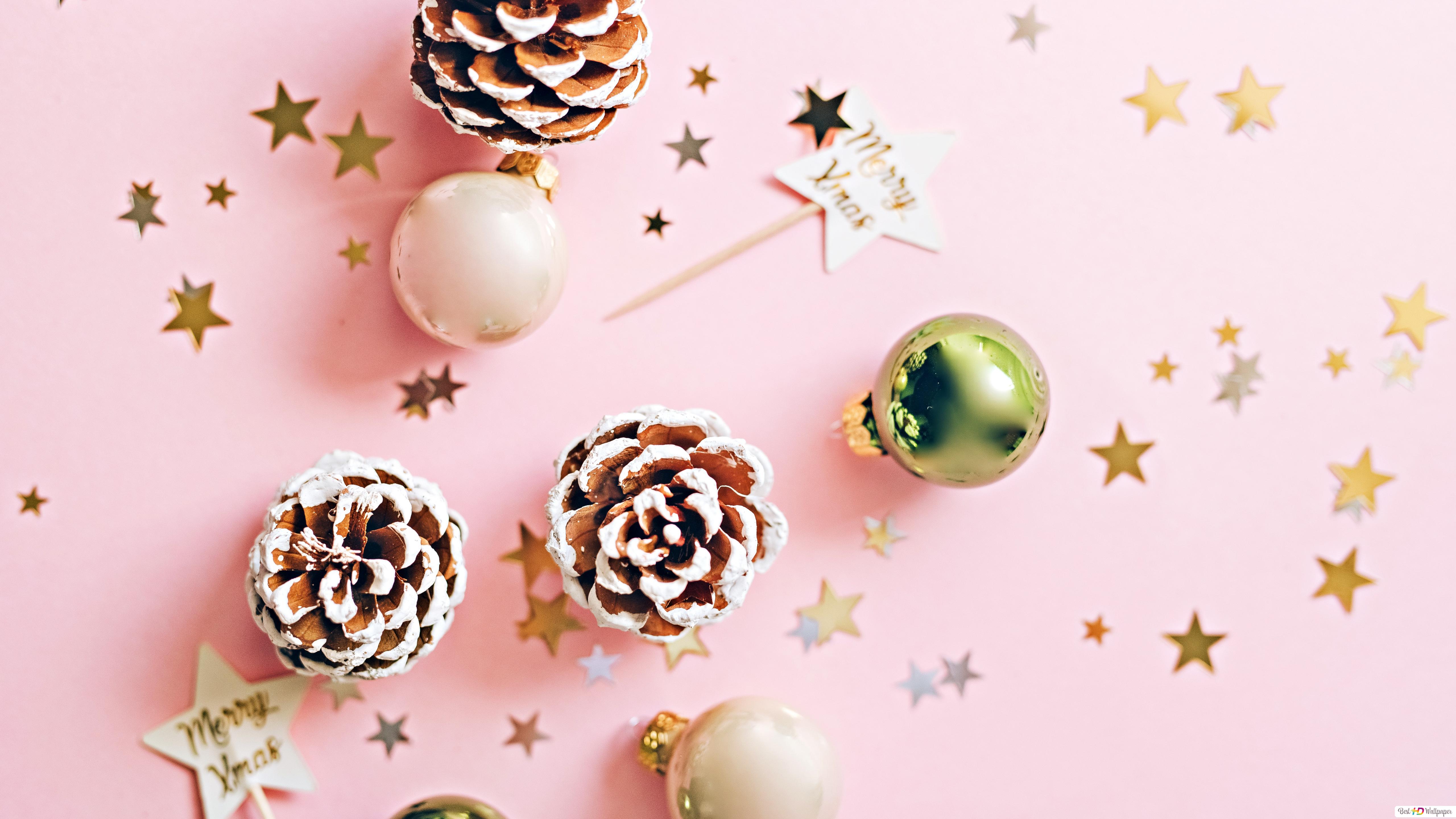 Merry Xmas greetings in pink background with stars, baubles and pinecones HD wallpaper download