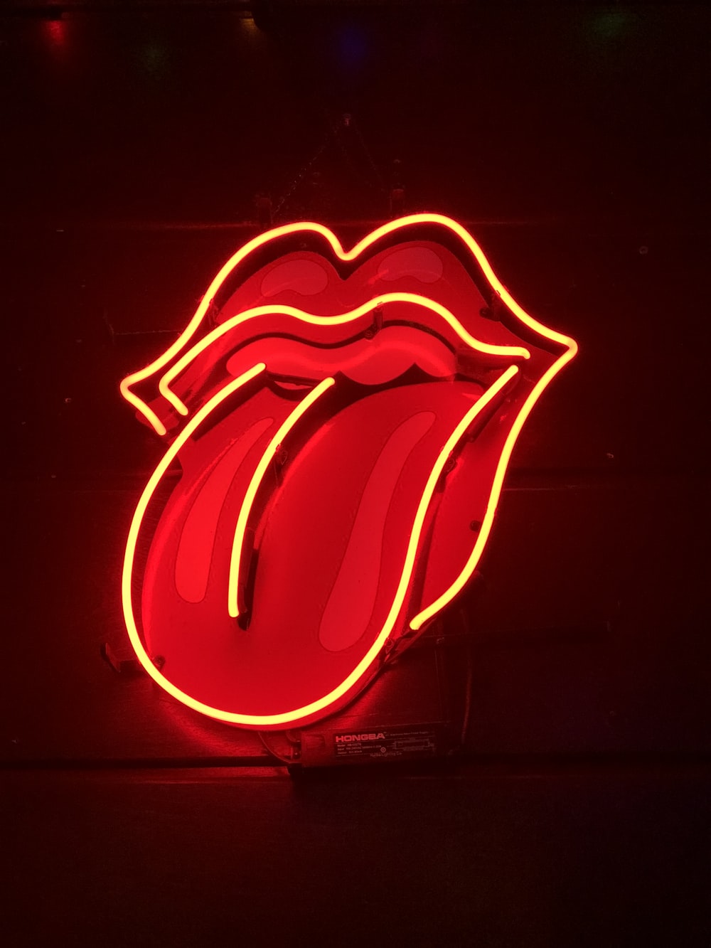 red tongue out neon light signage turned on photo