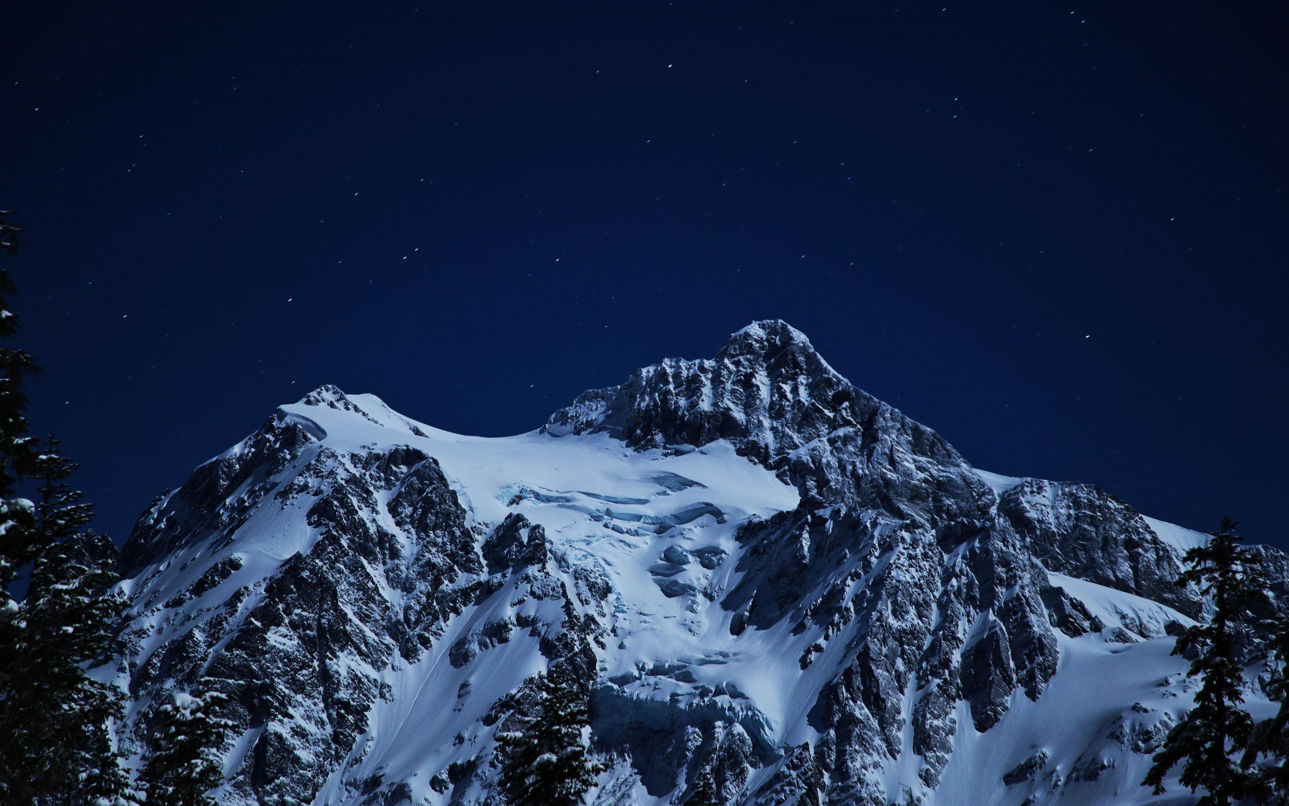 snow capped mountains during night time 5k MacBook Air Wallpaper Download