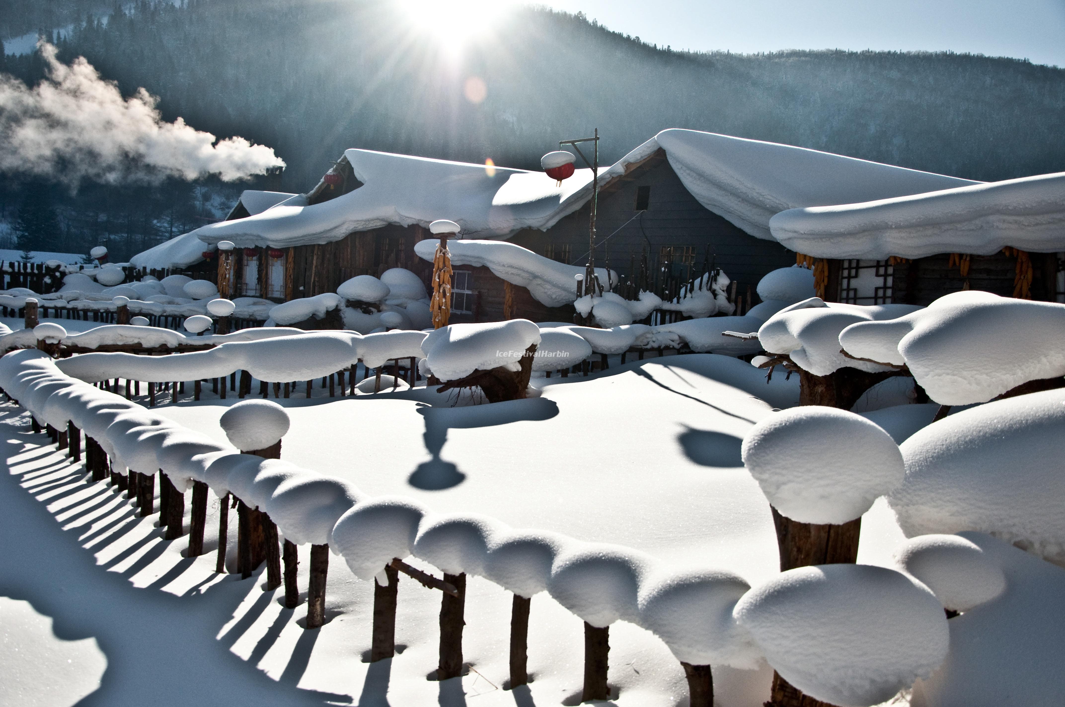 Wooden Houses in China's Snow Town Ice Festival Wallpaper, China