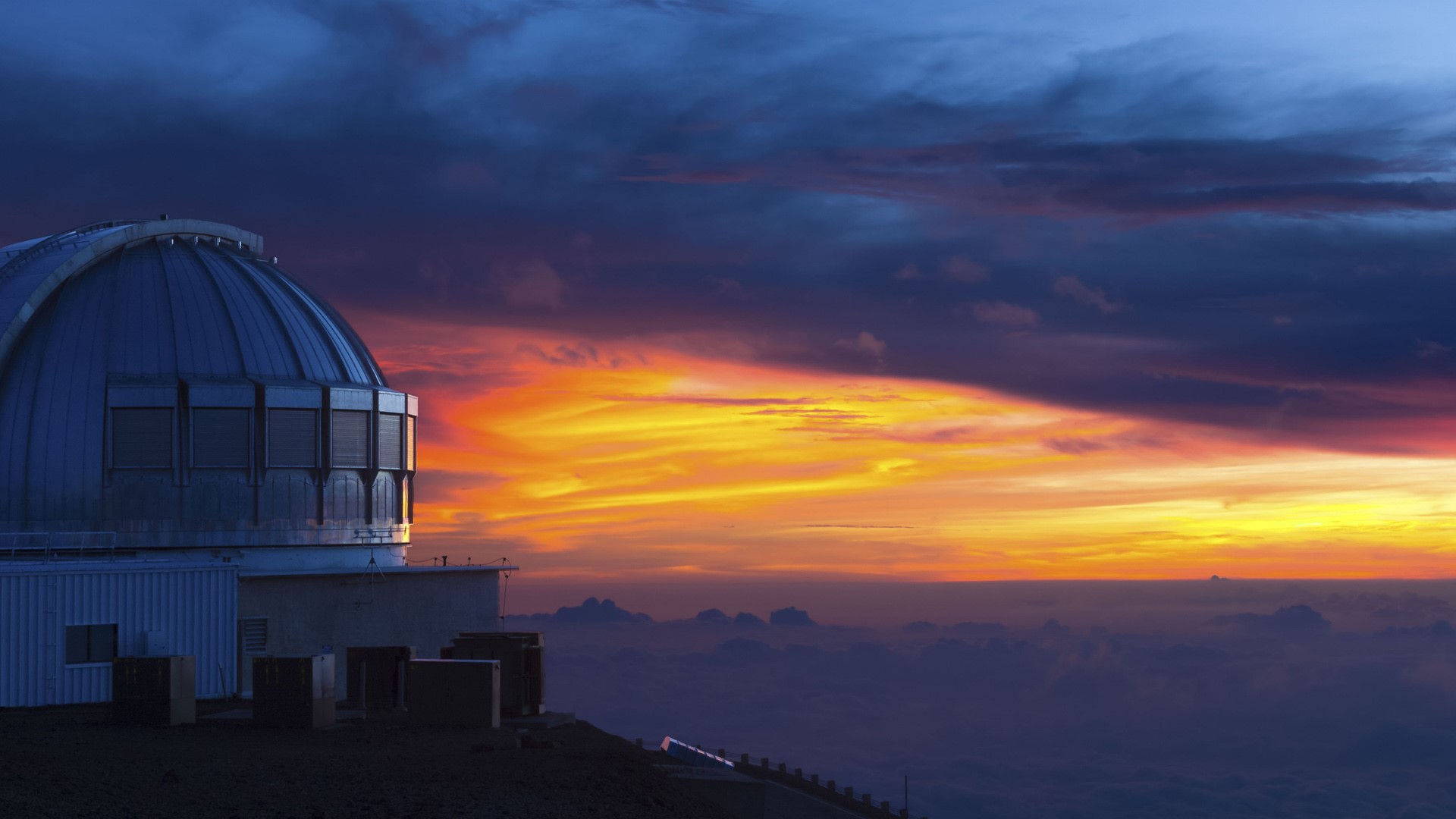 United Kingdom infrared telescope on Mauna Kea dormant volcano at sunset, Hawaii, USA. Windows 10 Spotlight Image